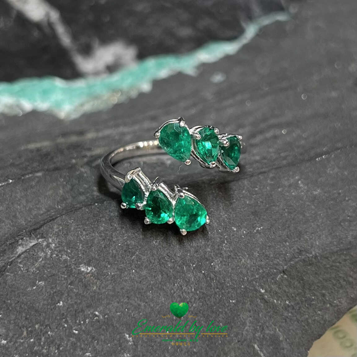 Sleek White Gold Ring: 1.31 TCW Teardrop Emeralds for a Stylish Modern Look