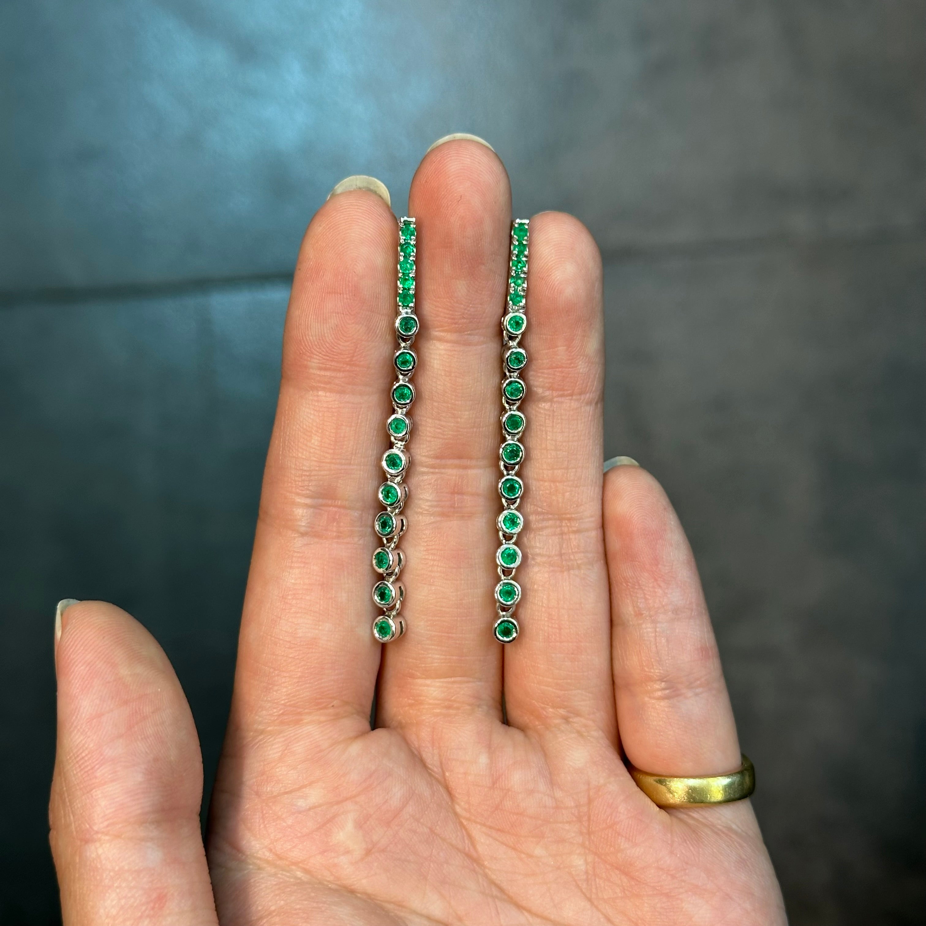 Elongated White Gold Earrings with Round Emeralds in Bezel Setting