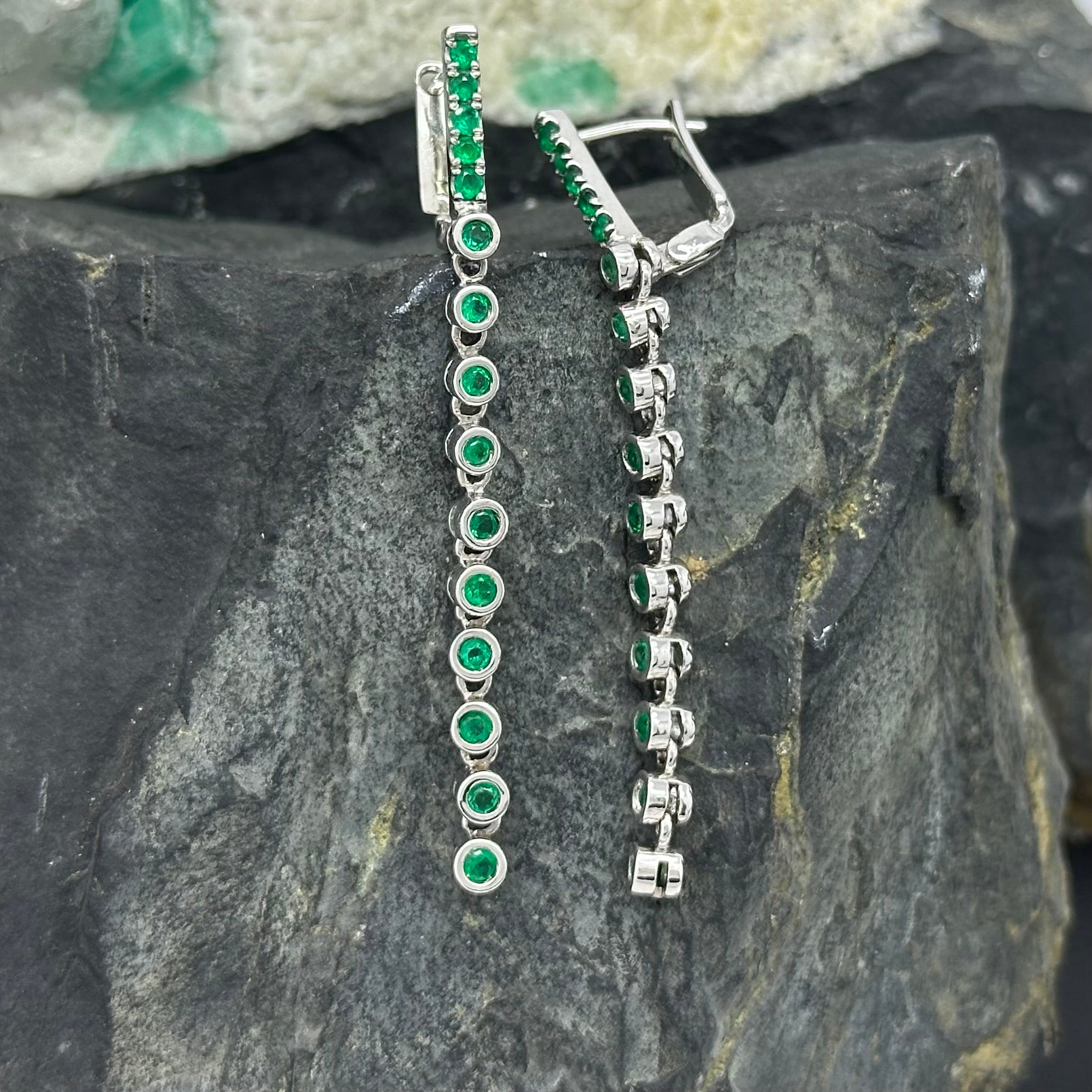 Elongated White Gold Earrings with Round Emeralds in Bezel Setting