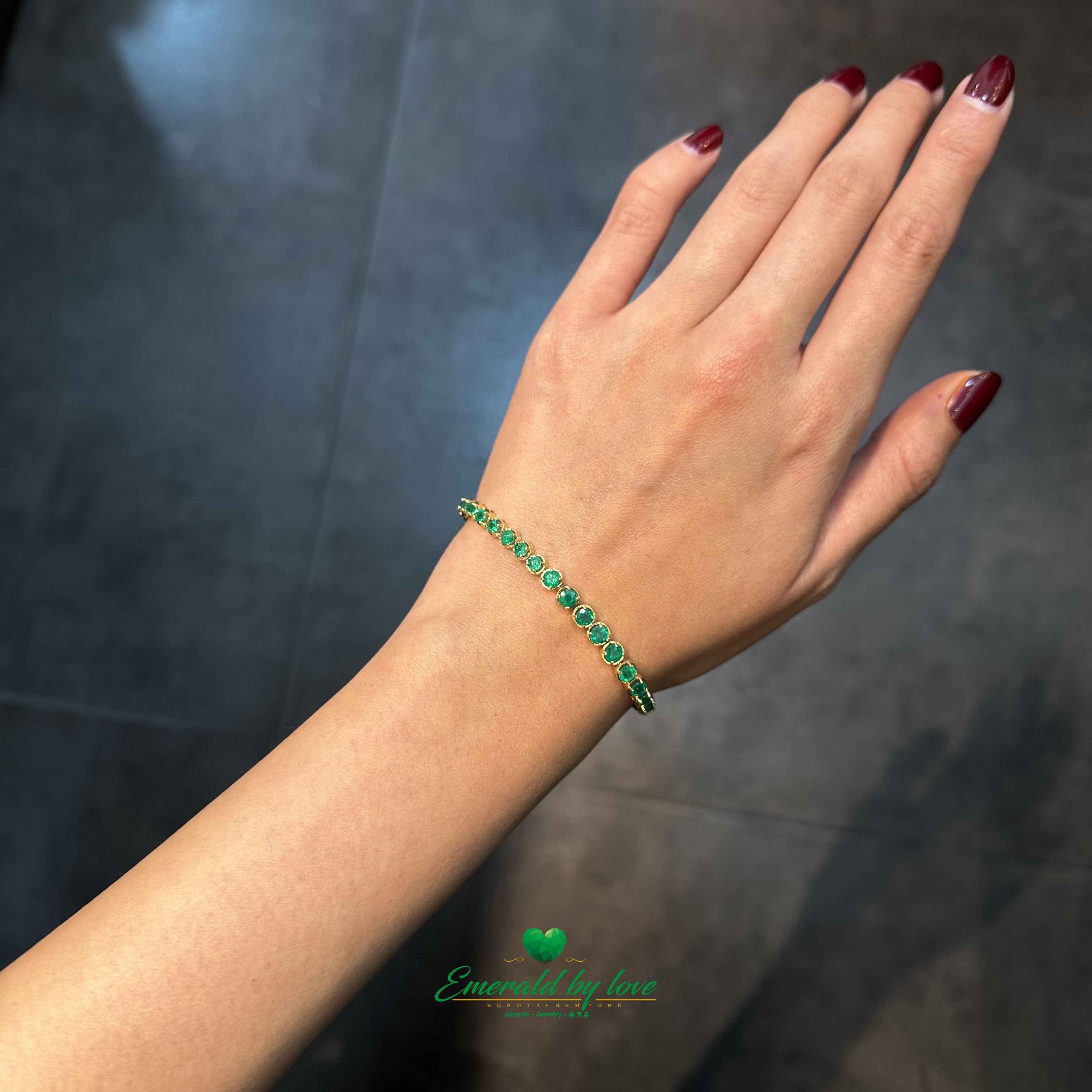 Tennis Bracelet in 18K Yellow Gold with Round Colombian Emeralds in Four-Prong Settings
