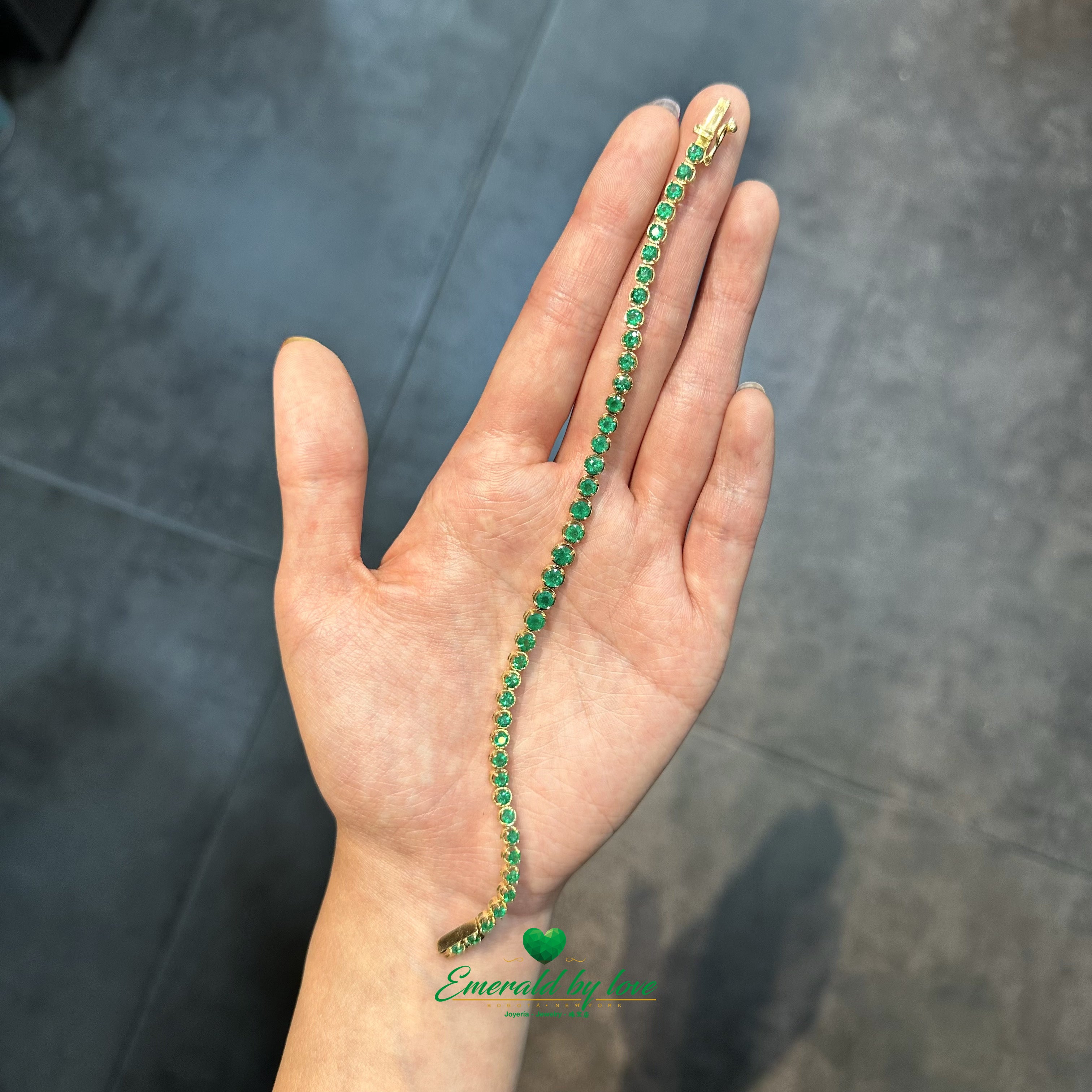 Tennis Bracelet in 18K Yellow Gold with Round Colombian Emeralds in Four-Prong Settings