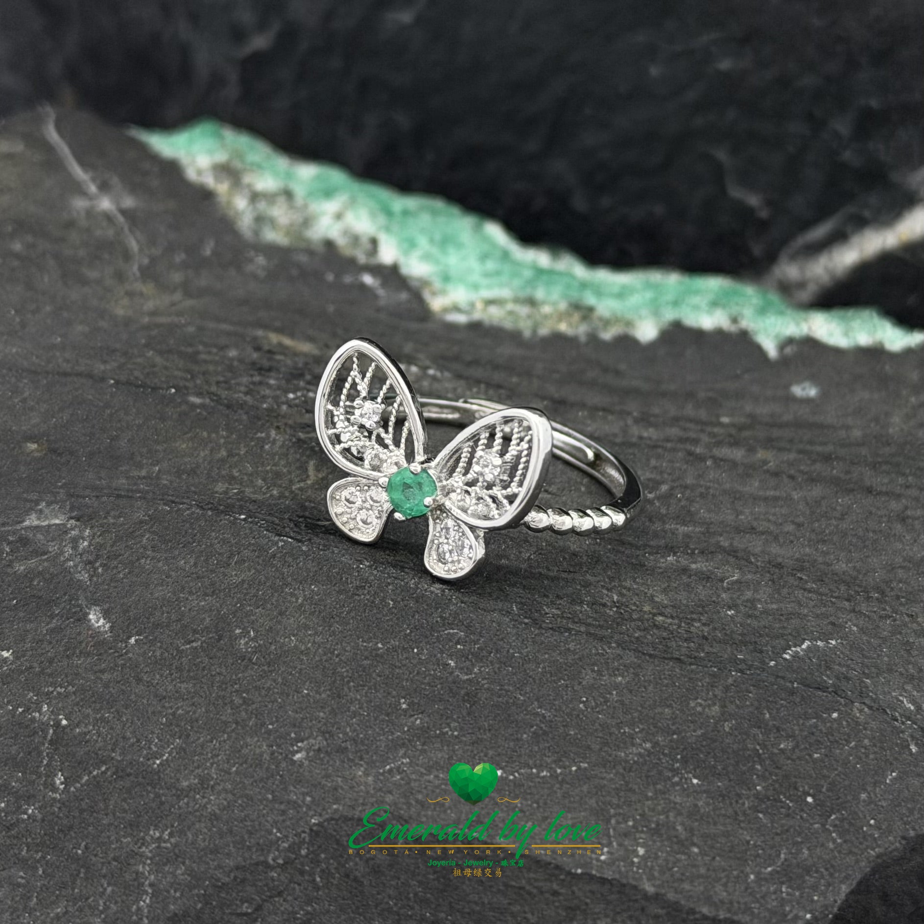 Silver Ring Featuring a Round Emerald and Butterfly Motif