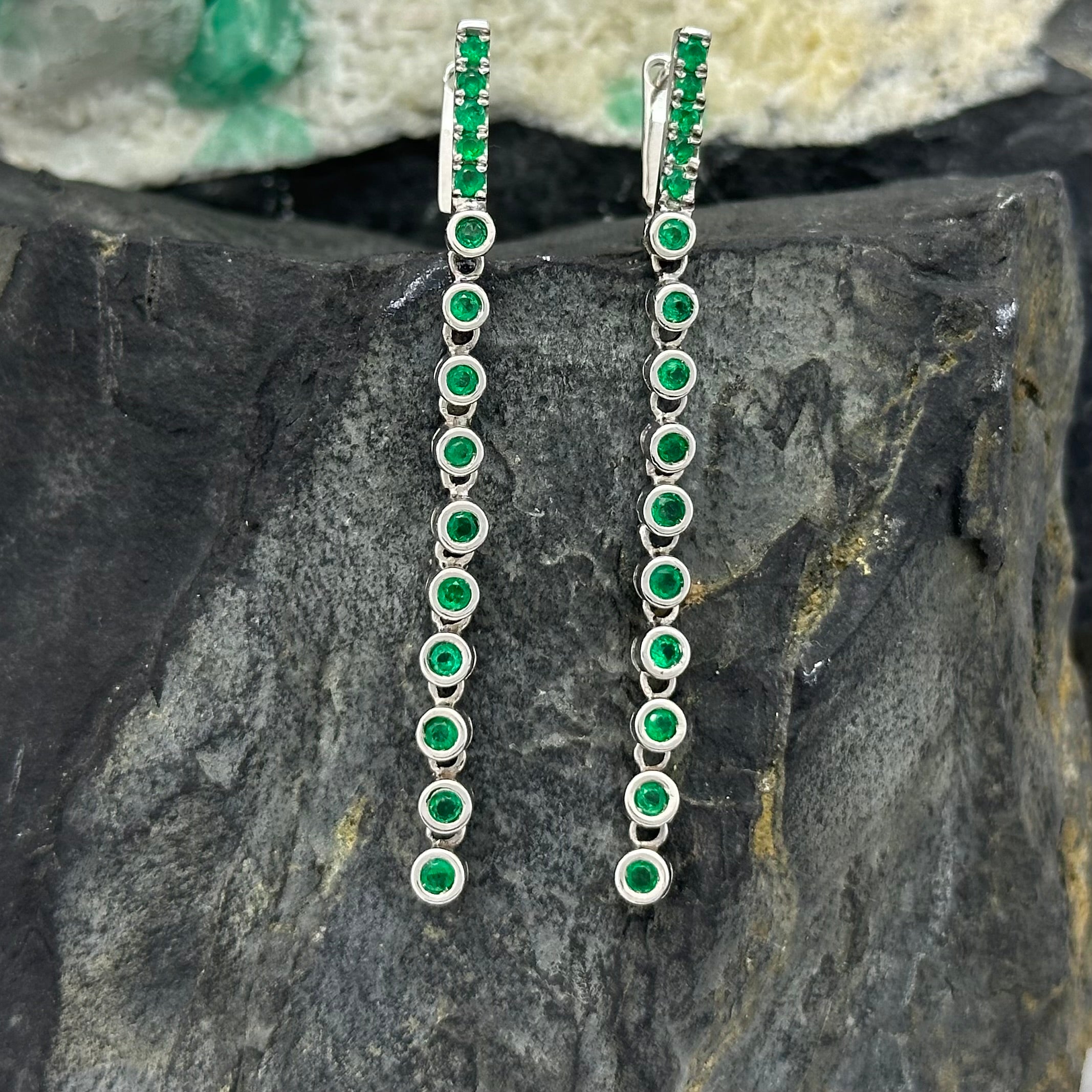 Elongated White Gold Earrings with Round Emeralds in Bezel Setting