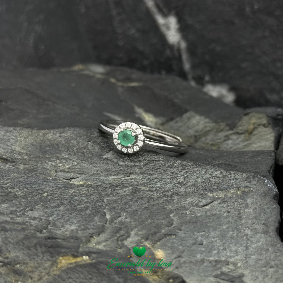 Delicate Emerald Ring with White Zircon Surround