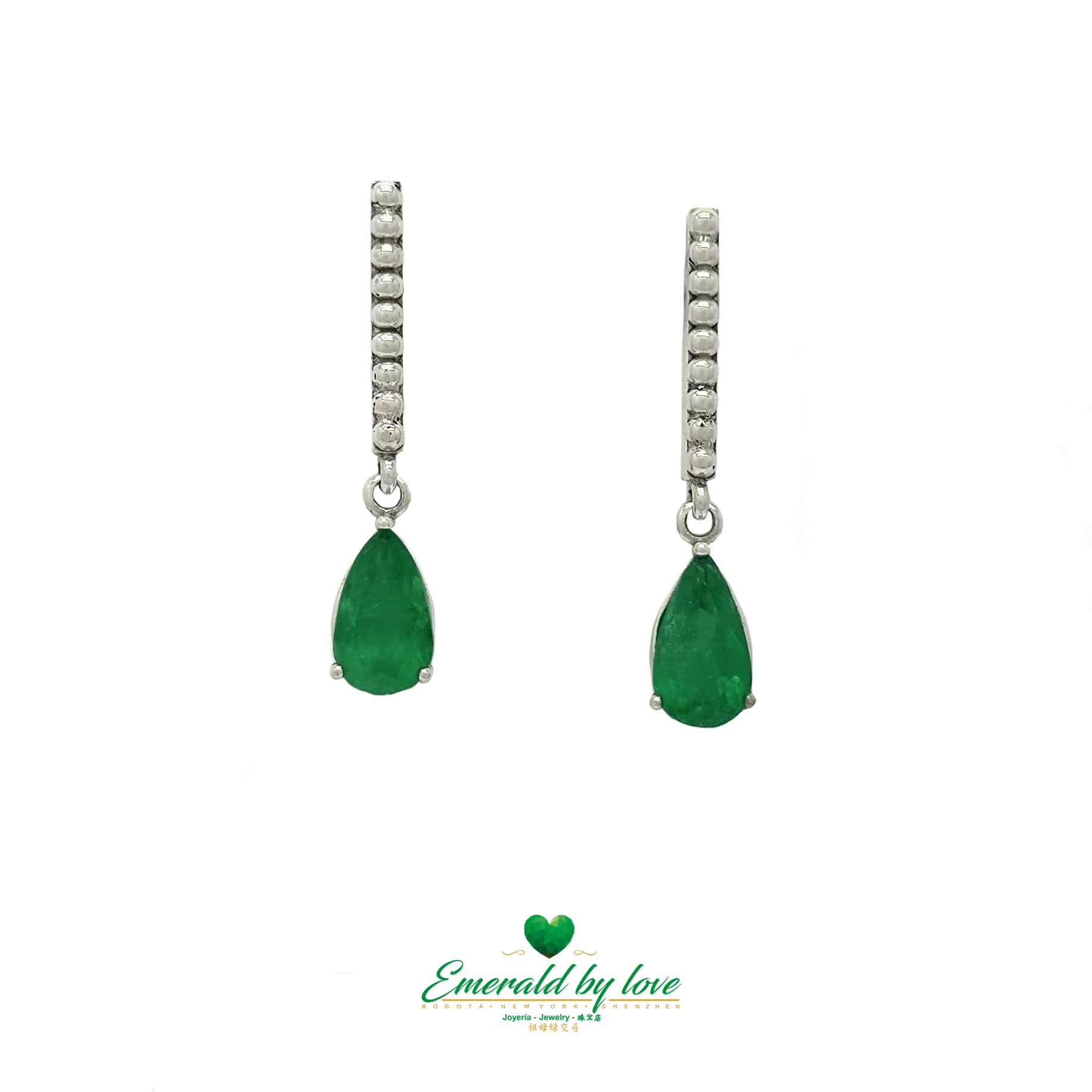 White Gold Serenity: Teardrop Emerald Earrings with Lengthwise Texture