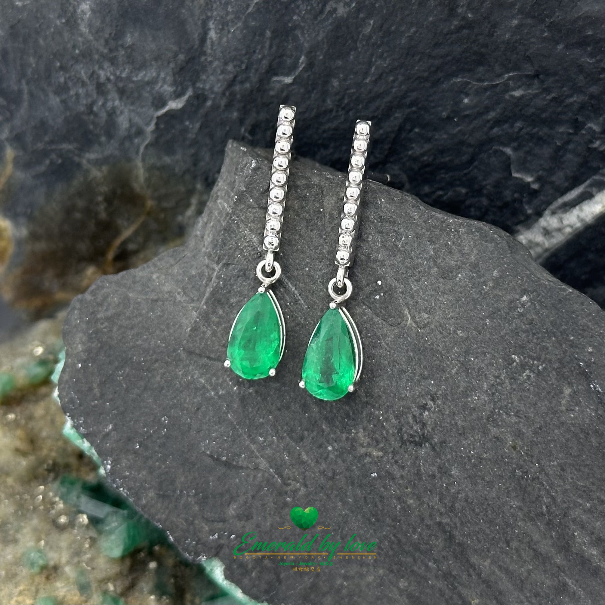 White Gold Serenity: Teardrop Emerald Earrings with Lengthwise Texture