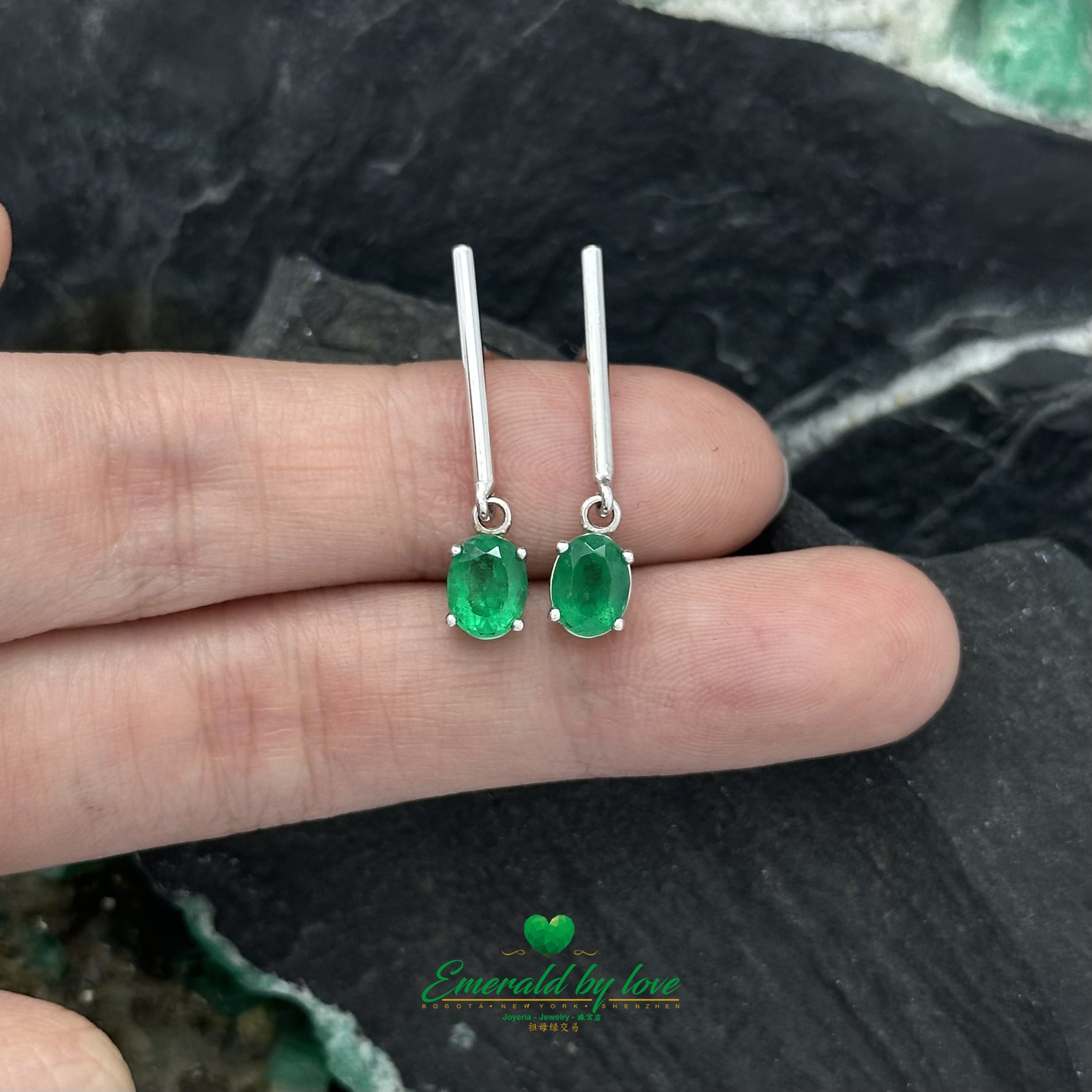 Timeless Glamour: Long White Gold Earrings with Oval Emeralds