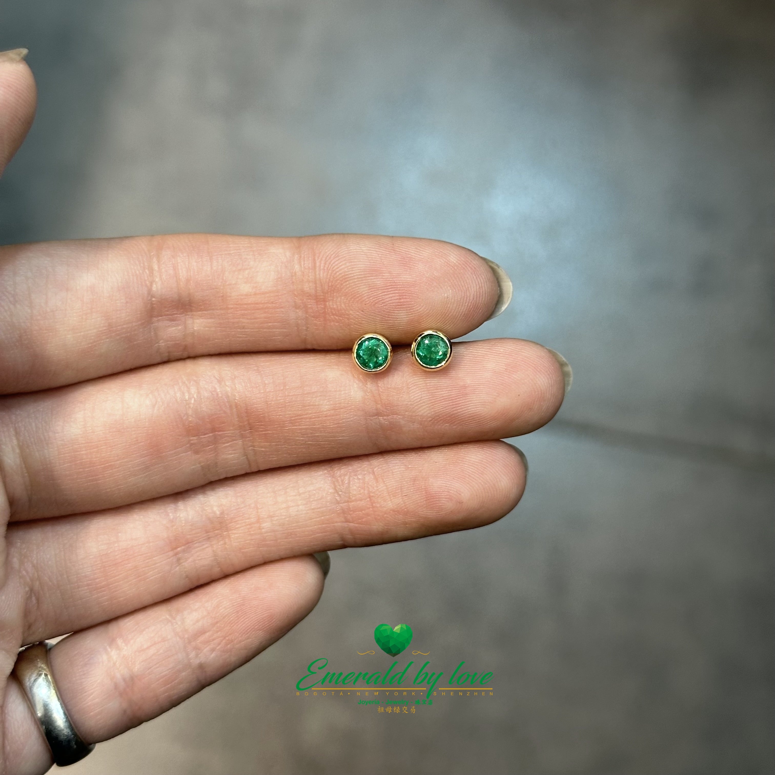 Yellow Gold Round Emerald Studs in Bezel Setting