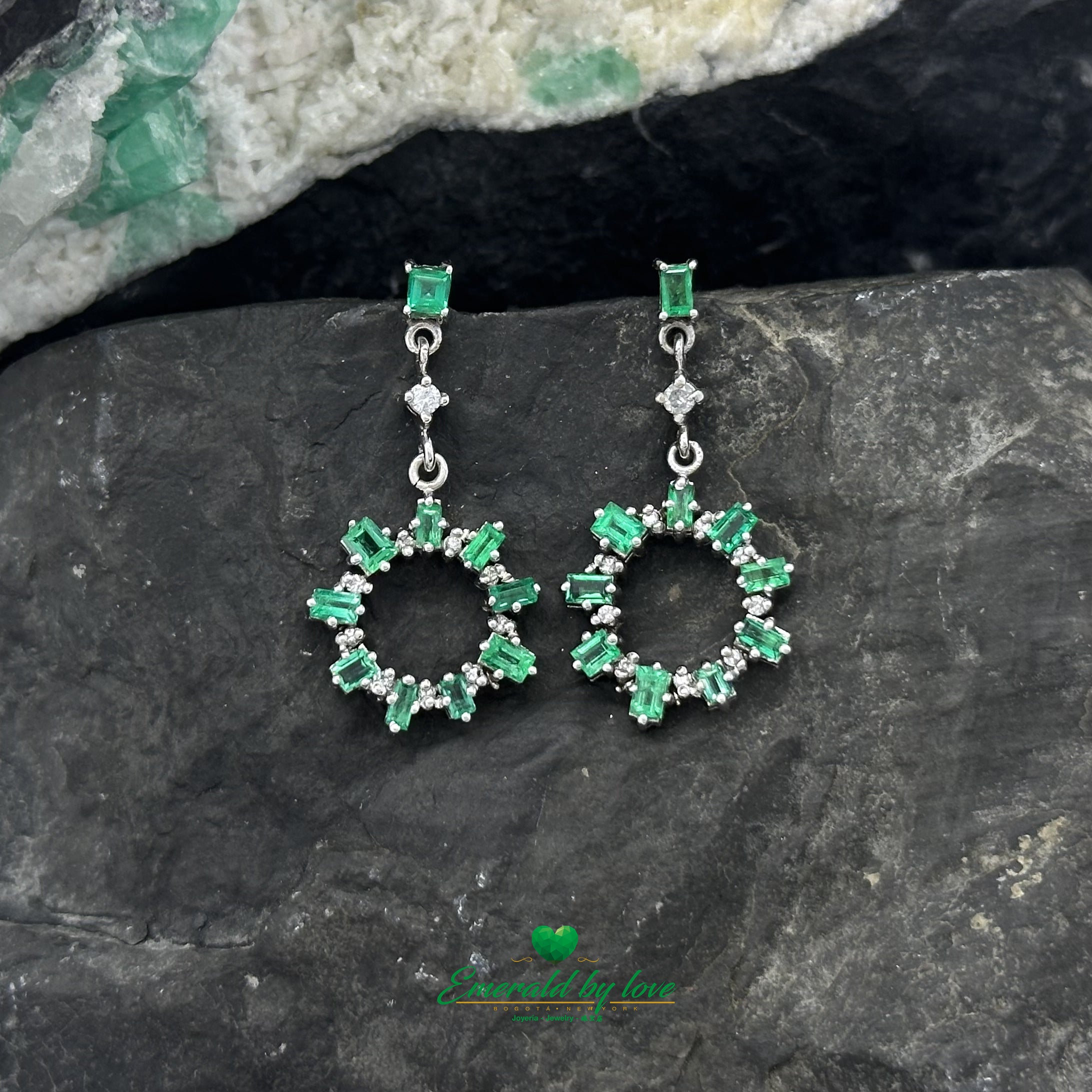 Elongated Earrings in White Gold with Baguette Emeralds, Diamonds, and Sunburst Detailing