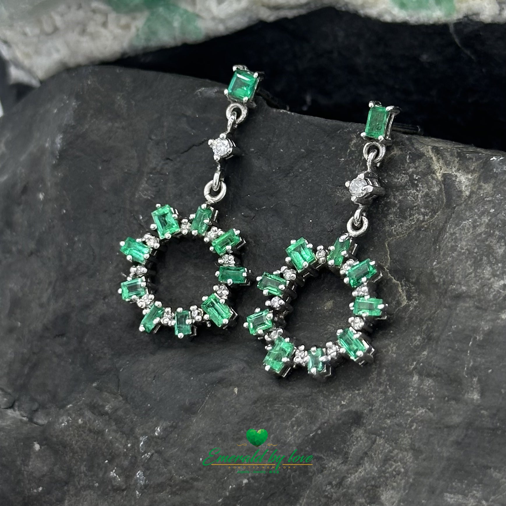 Elongated Earrings in White Gold with Baguette Emeralds, Diamonds, and Sunburst Detailing