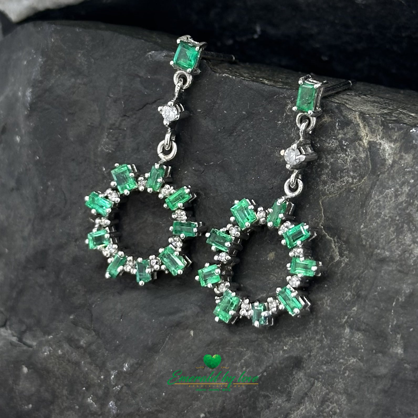 Elongated Earrings in White Gold with Baguette Emeralds, Diamonds, and Sunburst Detailing