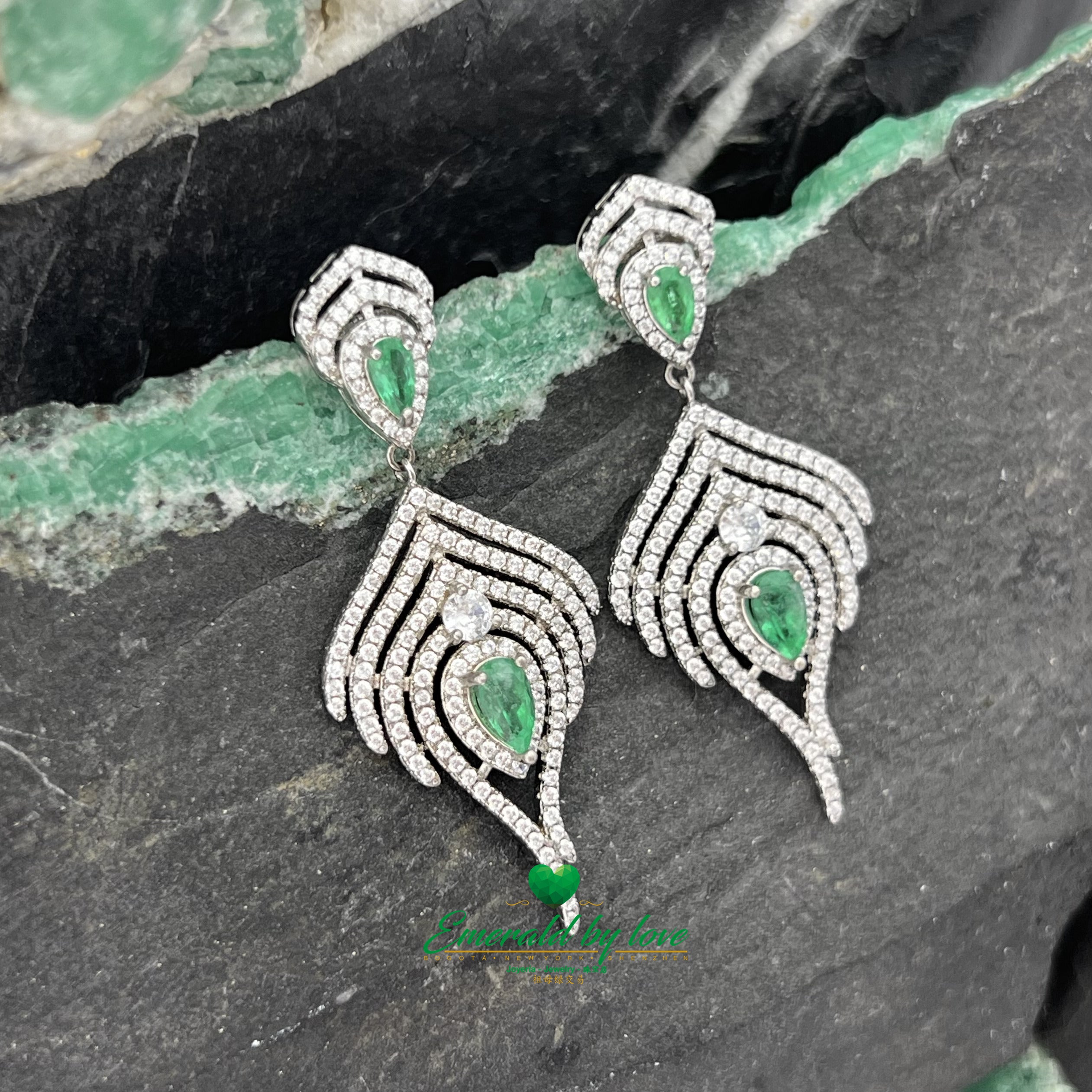 Majestic Long Silver Earrings with Teardrop Emeralds Surrounded by Cascading Zircon Brilliance