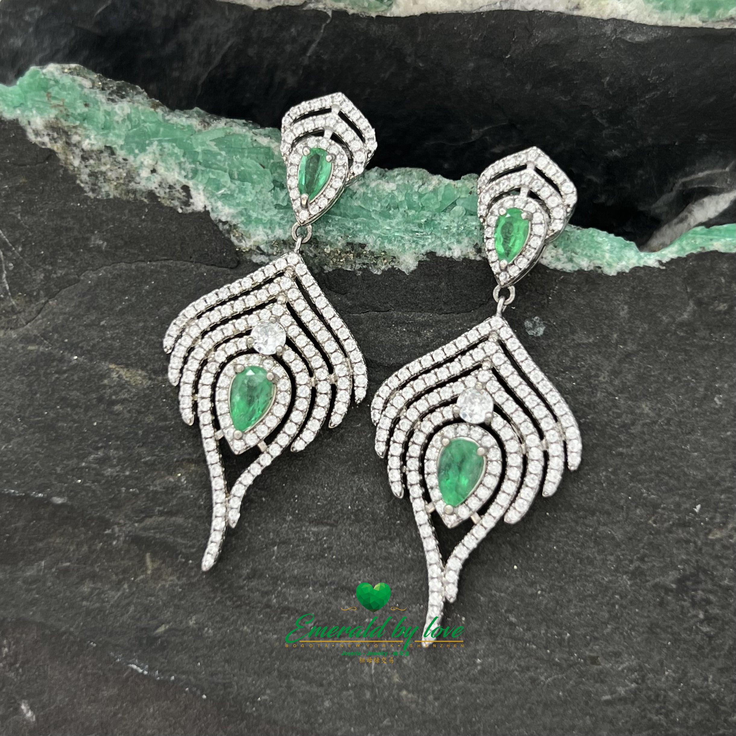 Majestic Long Silver Earrings with Teardrop Emeralds Surrounded by Cascading Zircon Brilliance