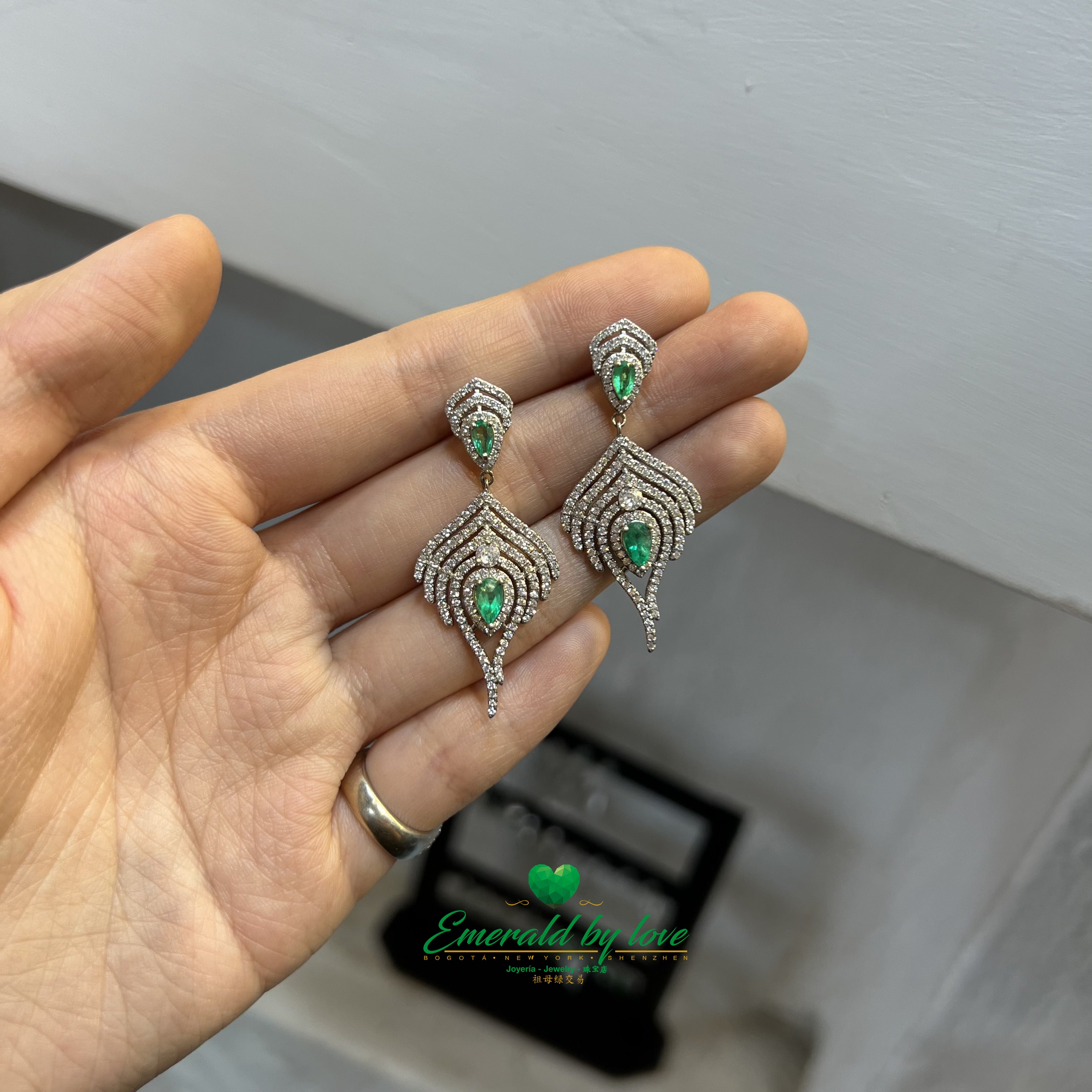 Majestic Long Silver Earrings with Teardrop Emeralds Surrounded by Cascading Zircon Brilliance