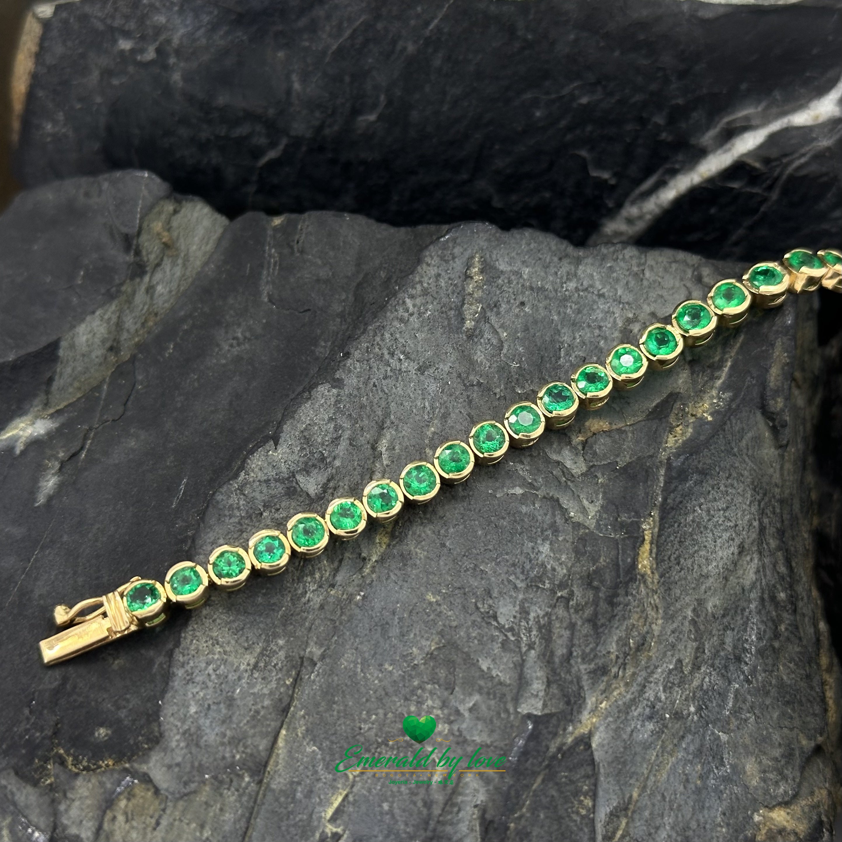 Slim bezel-set emerald bracelet crafted in 18K gold