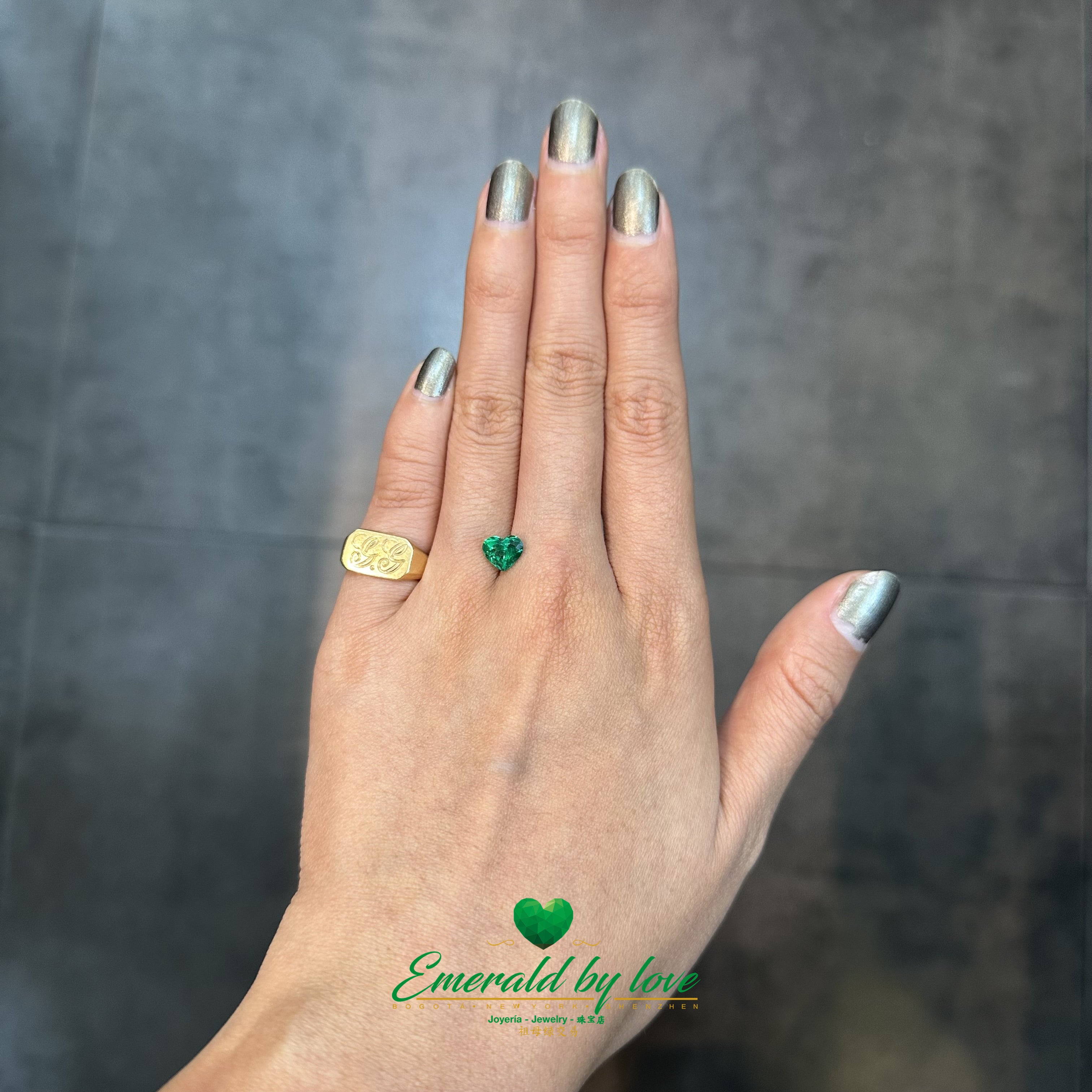 Heart-shaped 1.13 ct Colombian emerald with intense green hue, perfect for emotional designs