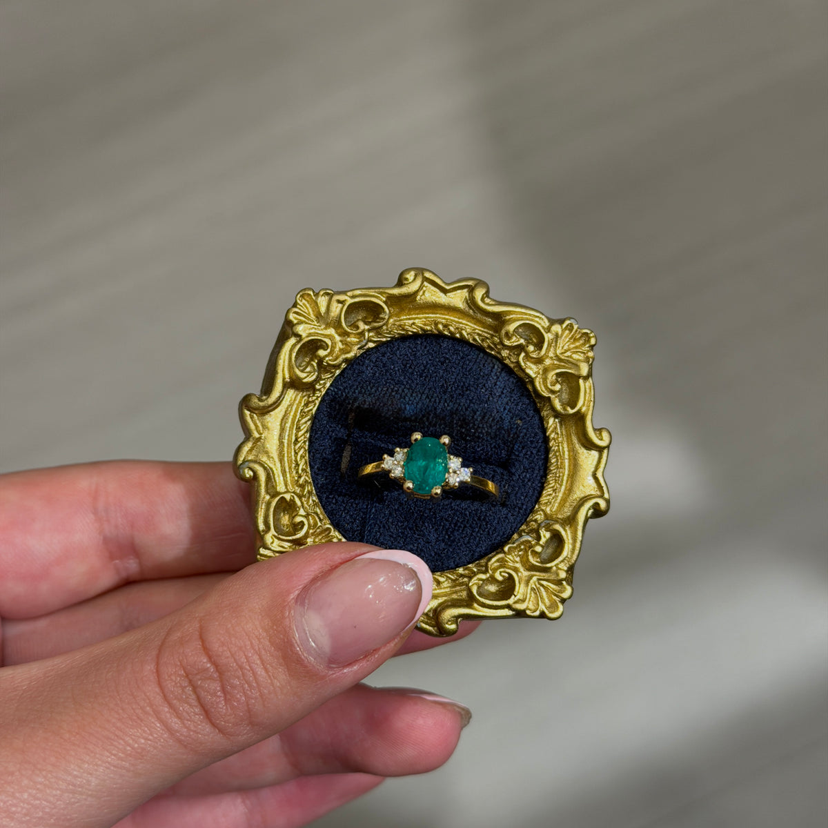 Yellow Gold Ring with Oval Colombian Emerald and Six Natural Diamonds