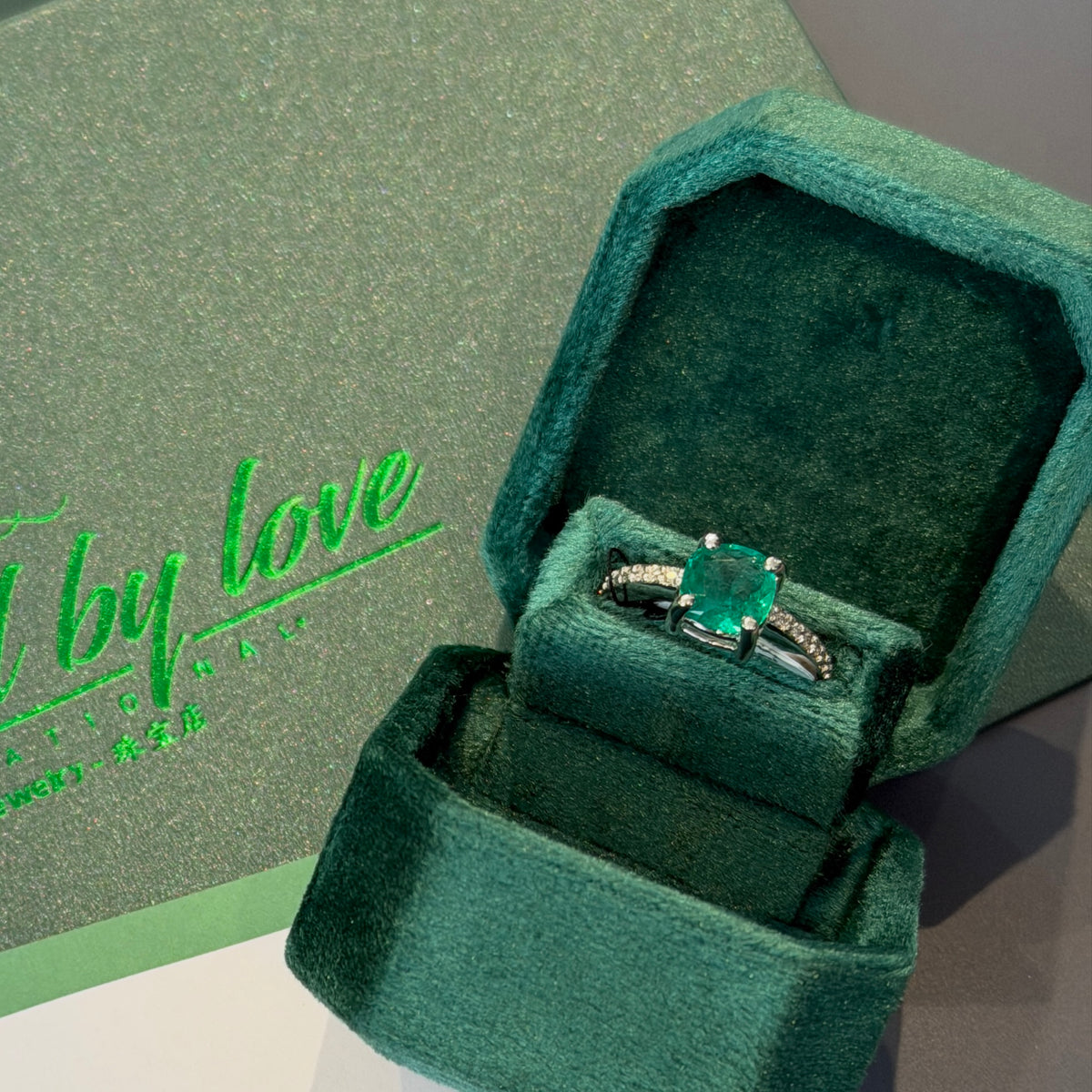 White Gold Ring with Cushion Colombian Emerald and Diamond Band