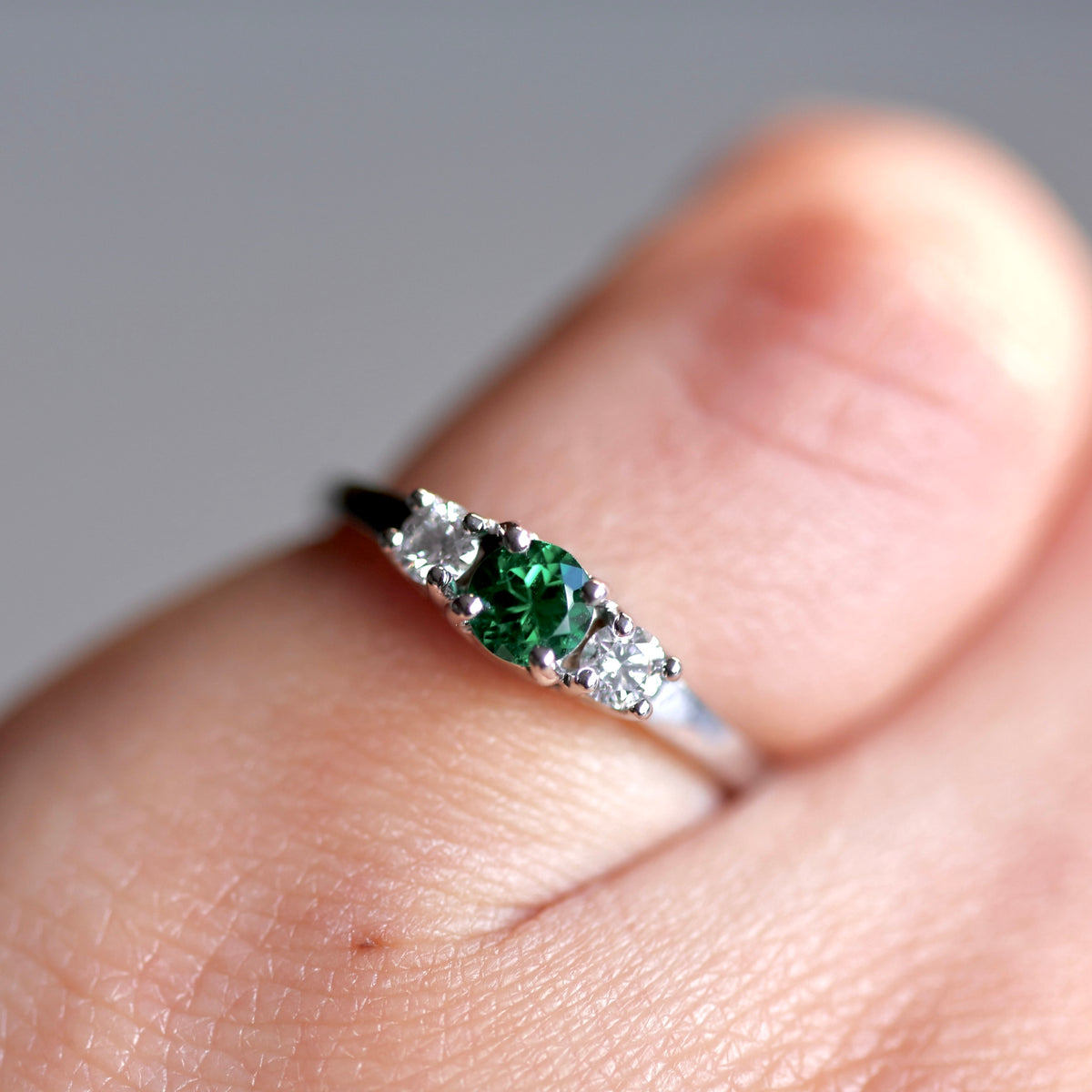 White Gold Ring with Round Colombian Emerald and Matching Round Diamonds