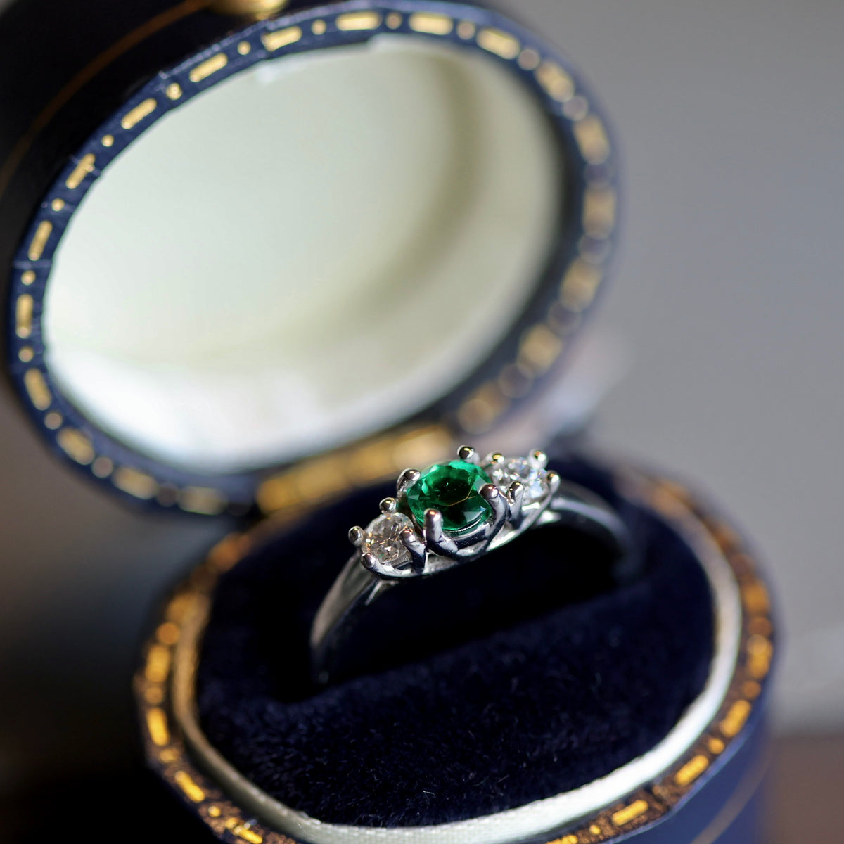 White Gold Ring with Round Colombian Emerald and Matching Round Diamonds