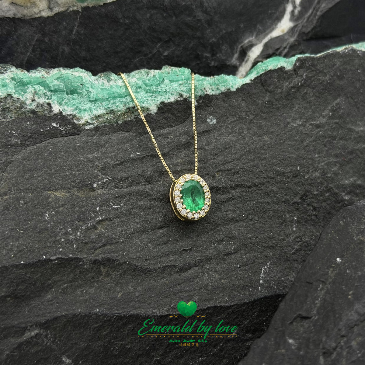 Oval Emerald & Diamond Surround Set in Yellow Gold