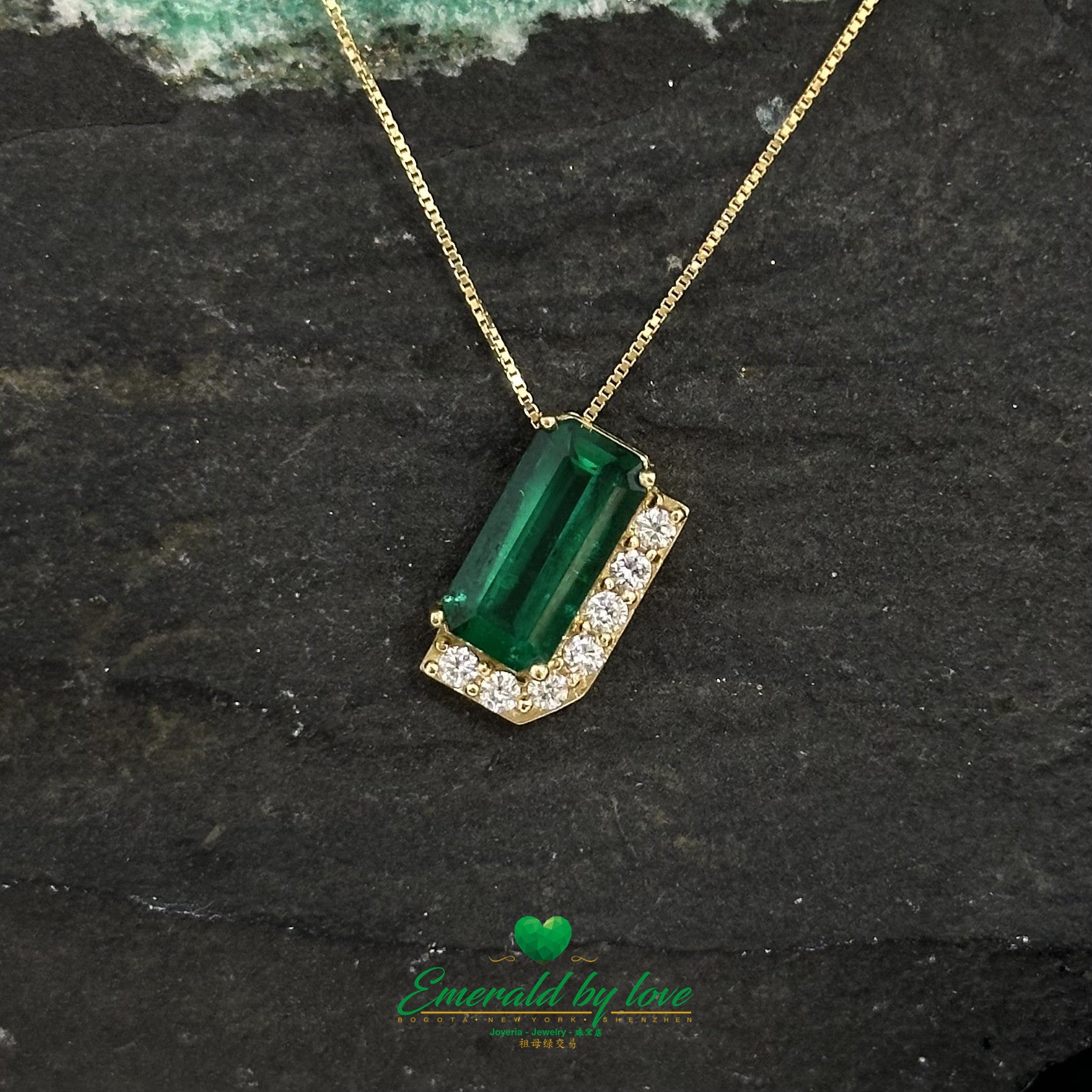 Luxurious Yellow Gold Pendant with 1.66 Ct Rectangular Emerald and Diamond Accent