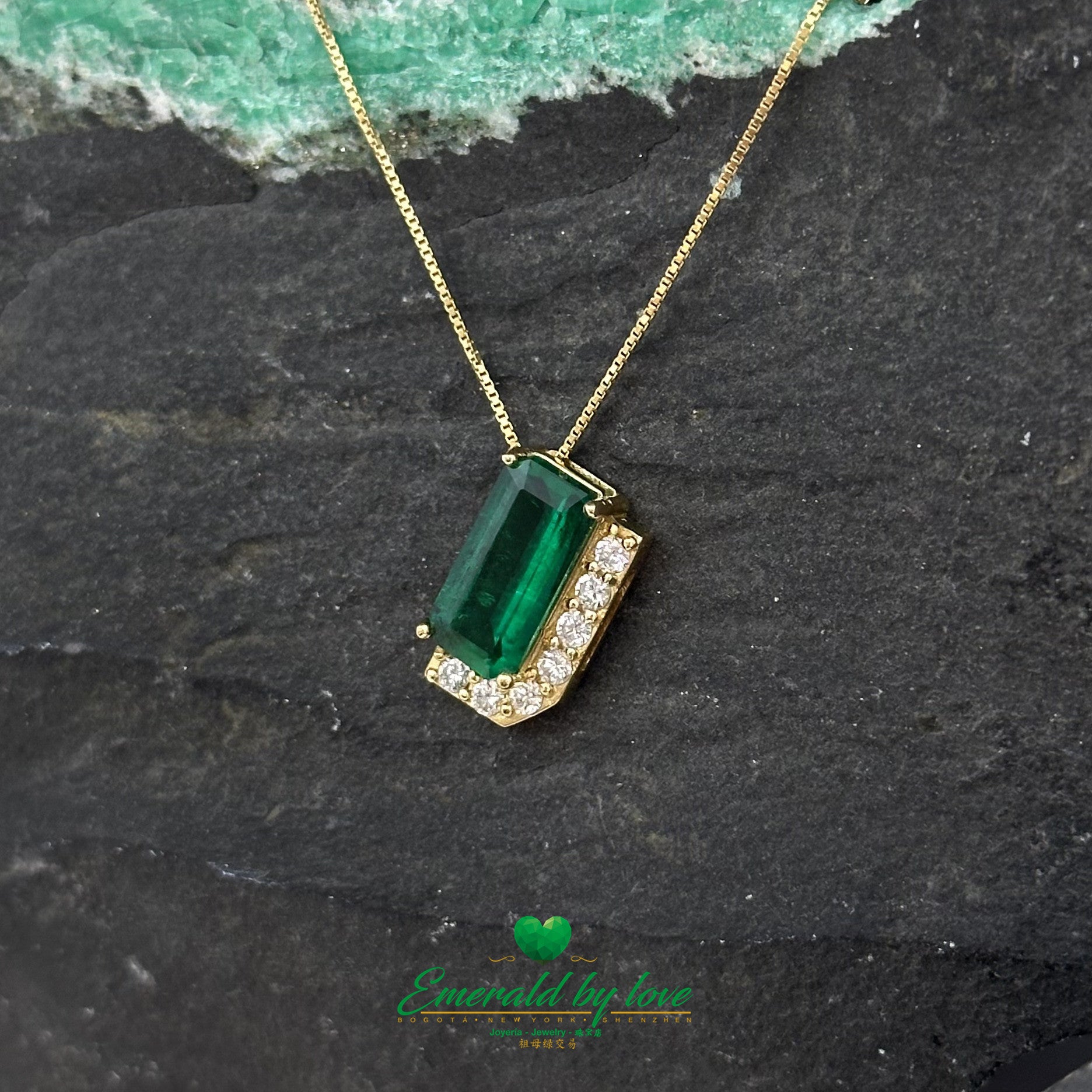 Luxurious Yellow Gold Pendant with 1.66 Ct Rectangular Emerald and Diamond Accent