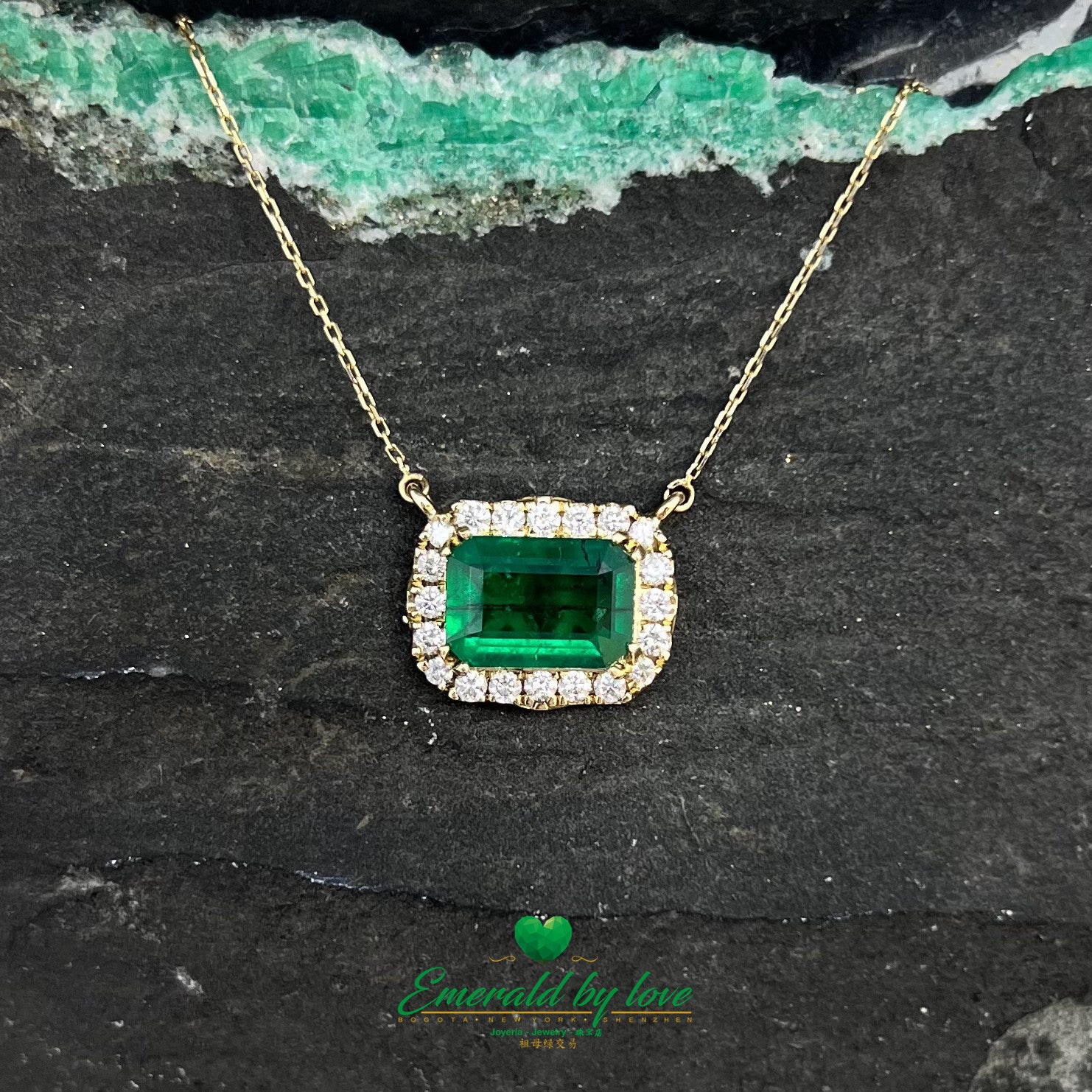 Stunning Yellow Gold Marquise Pendant with 1.85 Ct Emerald Cut Emerald and Diamond Halo