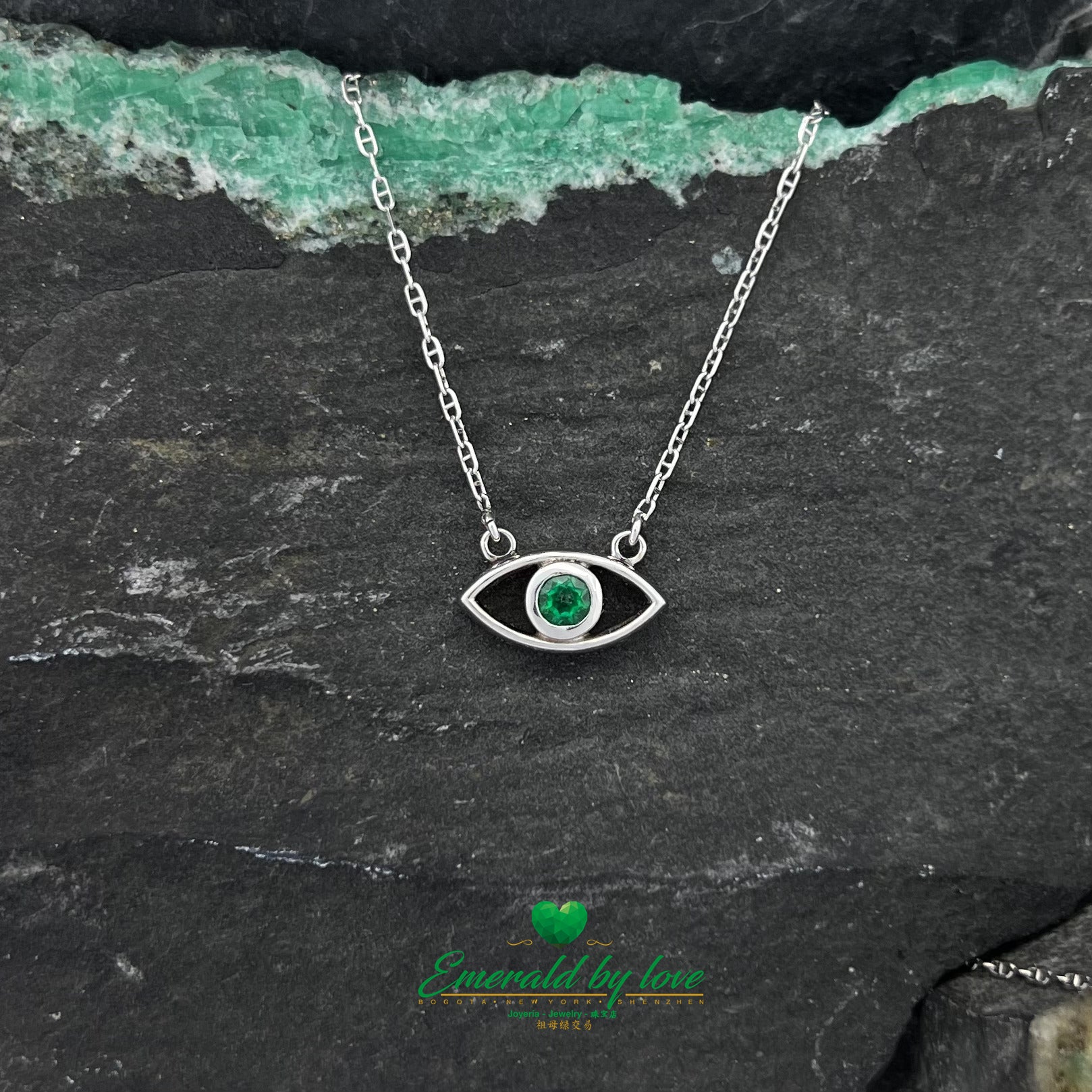 Ethereal Gaze: White Gold Eye Pendant with Round Emerald Center