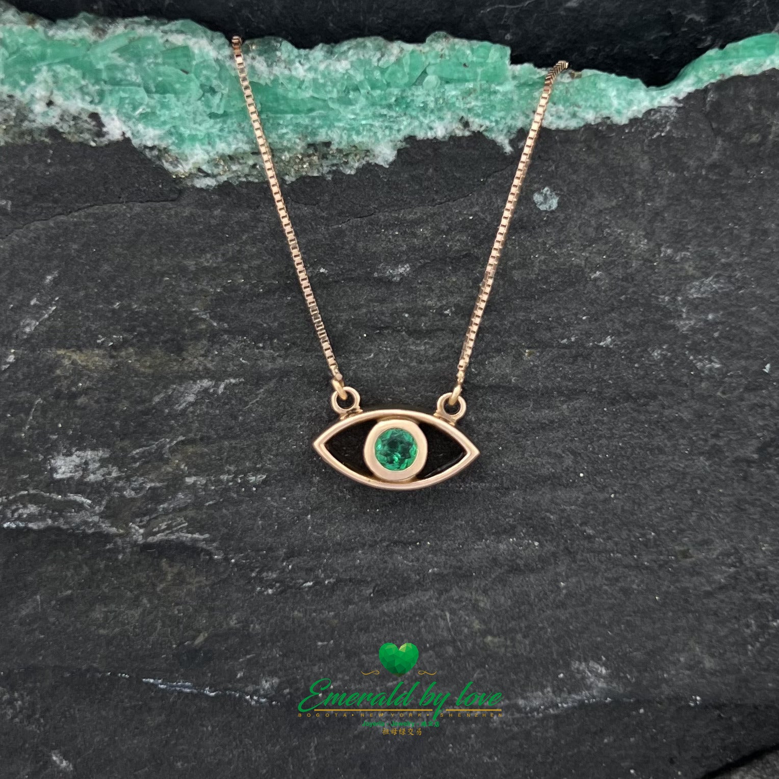 Roseate Vision: Rose Gold Eye Pendant with Round Emerald Center