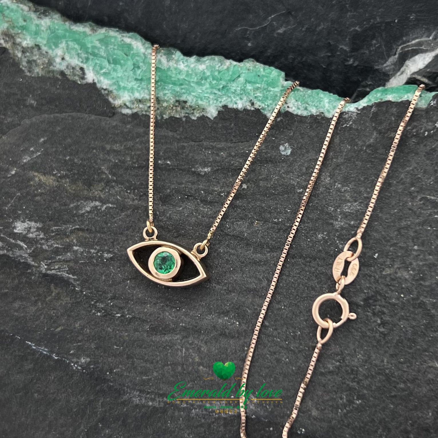 Roseate Vision: Rose Gold Eye Pendant with Round Emerald Center