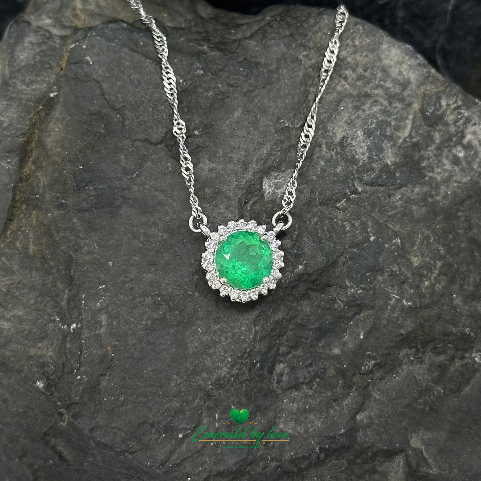 Floral Round Emerald and Diamond Halo Pendant in 18K White Gold