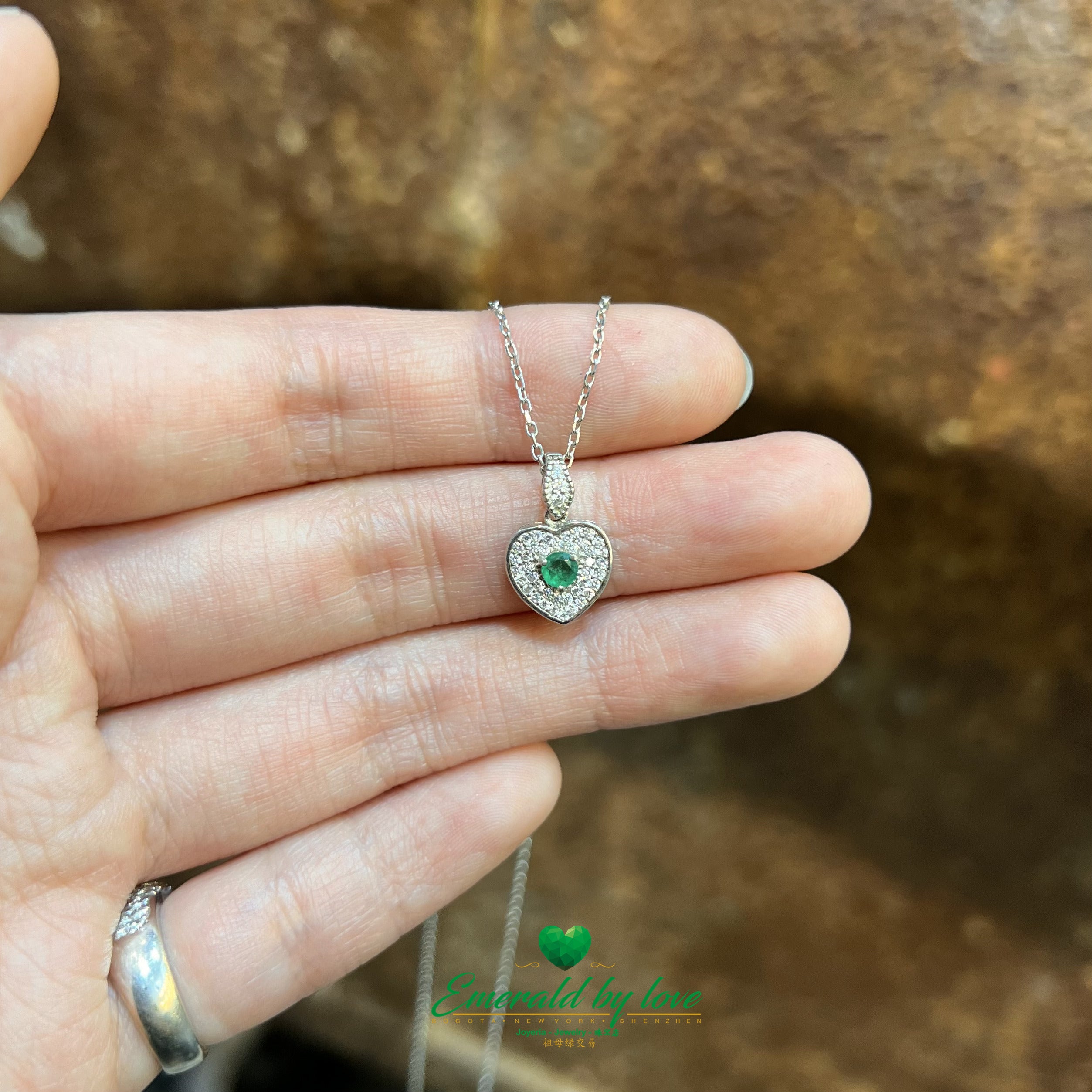 Heart-Shaped Silver Pendant with Central Round Emerald and White Zirconia