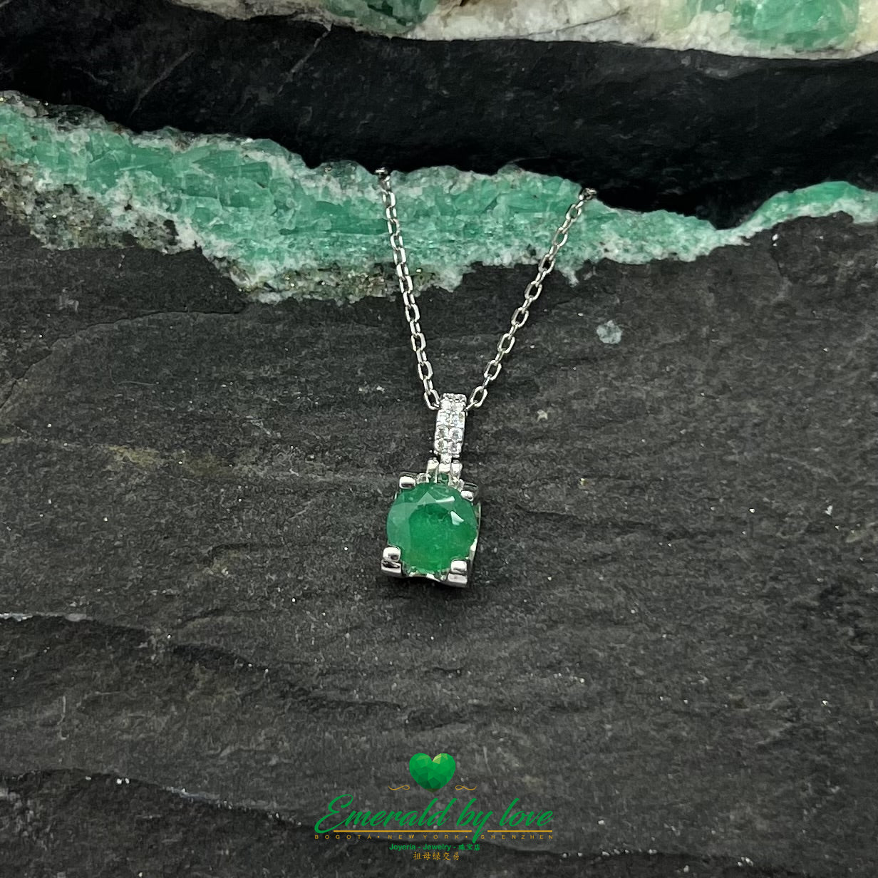 Elegant Round Emerald Pendant with Four-Prong Setting