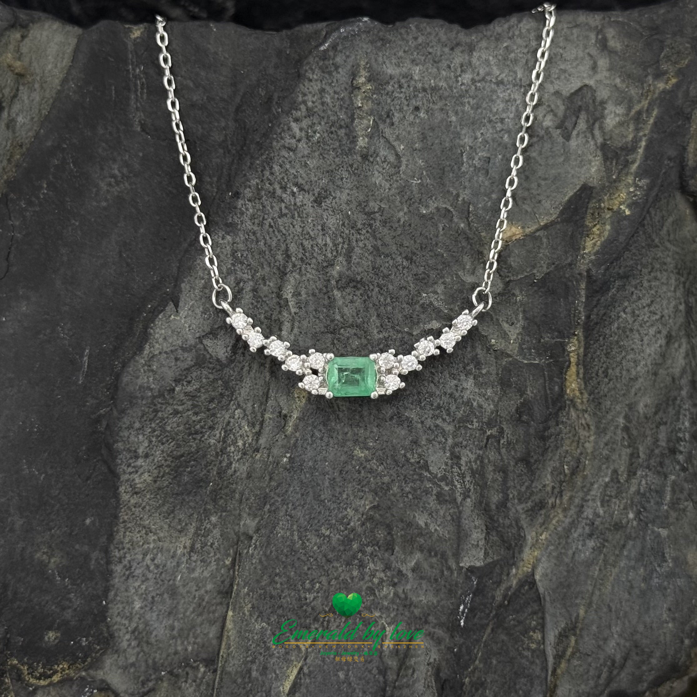 Curved Sterling Silver Pendant with Baguette-Cut Emerald and Side Cubic Zirconia