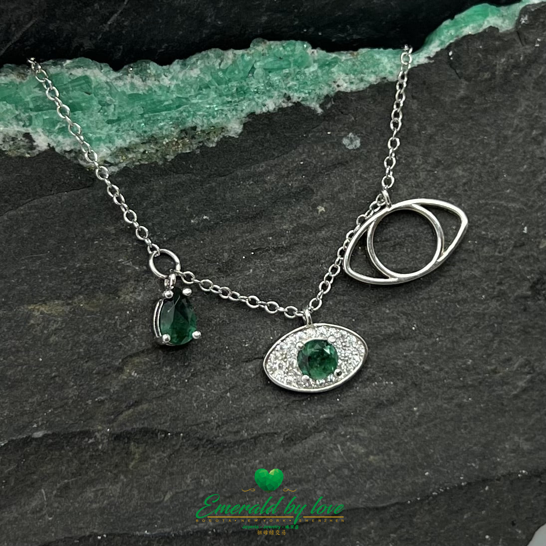 Silver Necklace with Three Eye Pendants, Two Featuring Round Emeralds