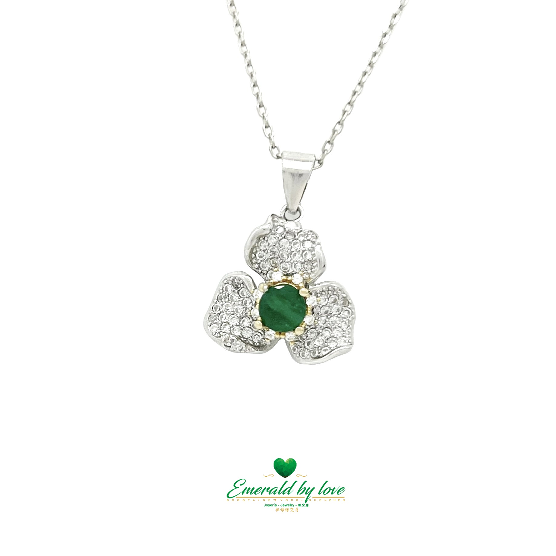 Exquisite Orchid Pendant with Central Emerald in Gold-Plated Prongs