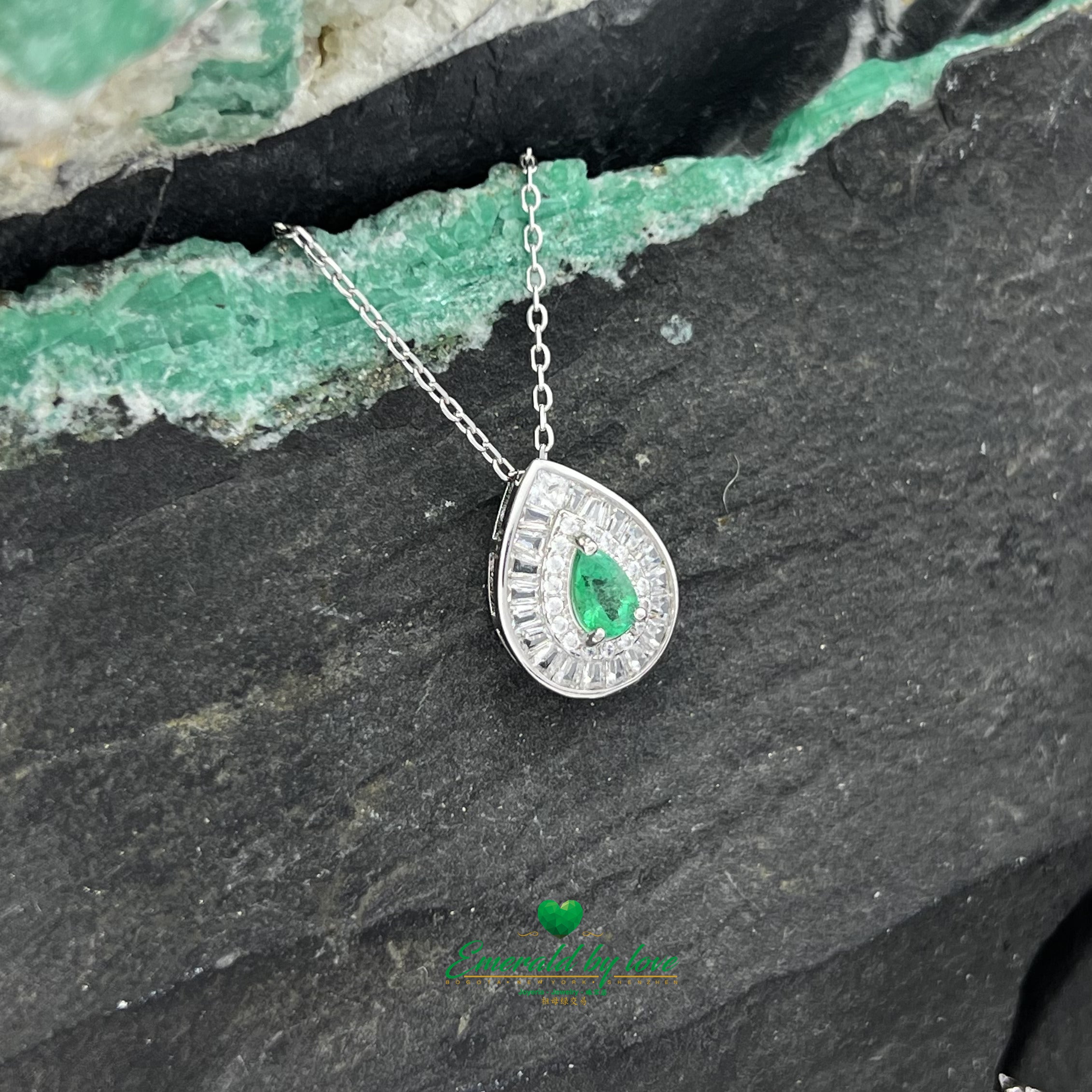 Pendant with Pear-Shaped Colombian Emerald Surrounded by Round and Baguette White Zircons