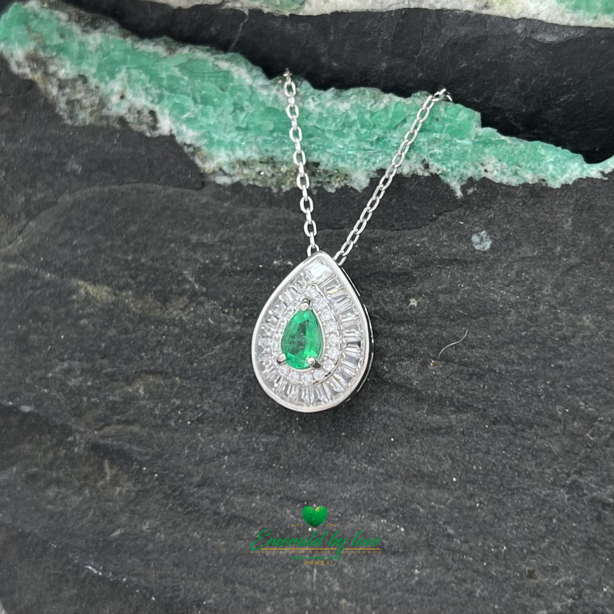 Pendant with Pear-Shaped Colombian Emerald Surrounded by Round and Baguette White Zircons