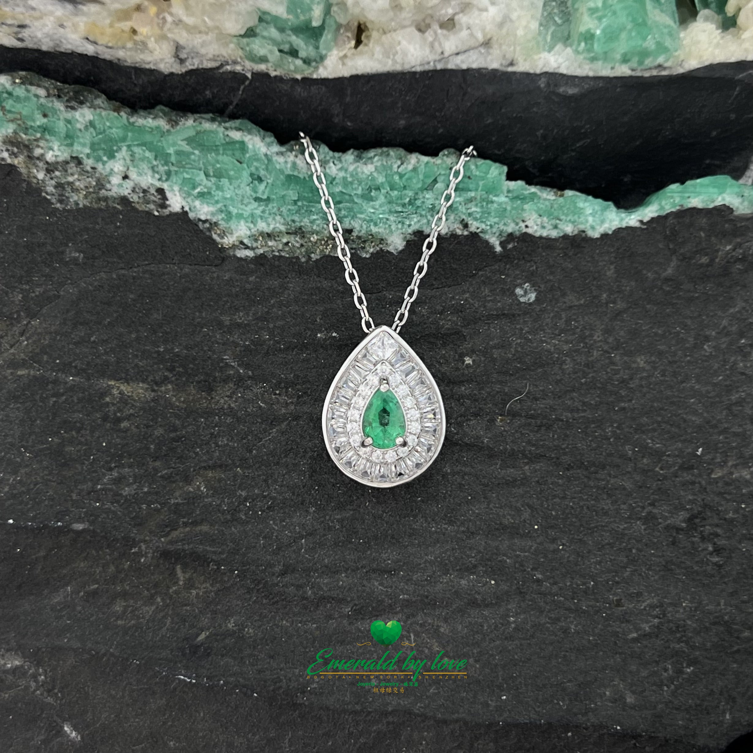 Pendant with Pear-Shaped Colombian Emerald Surrounded by Round and Baguette White Zircons