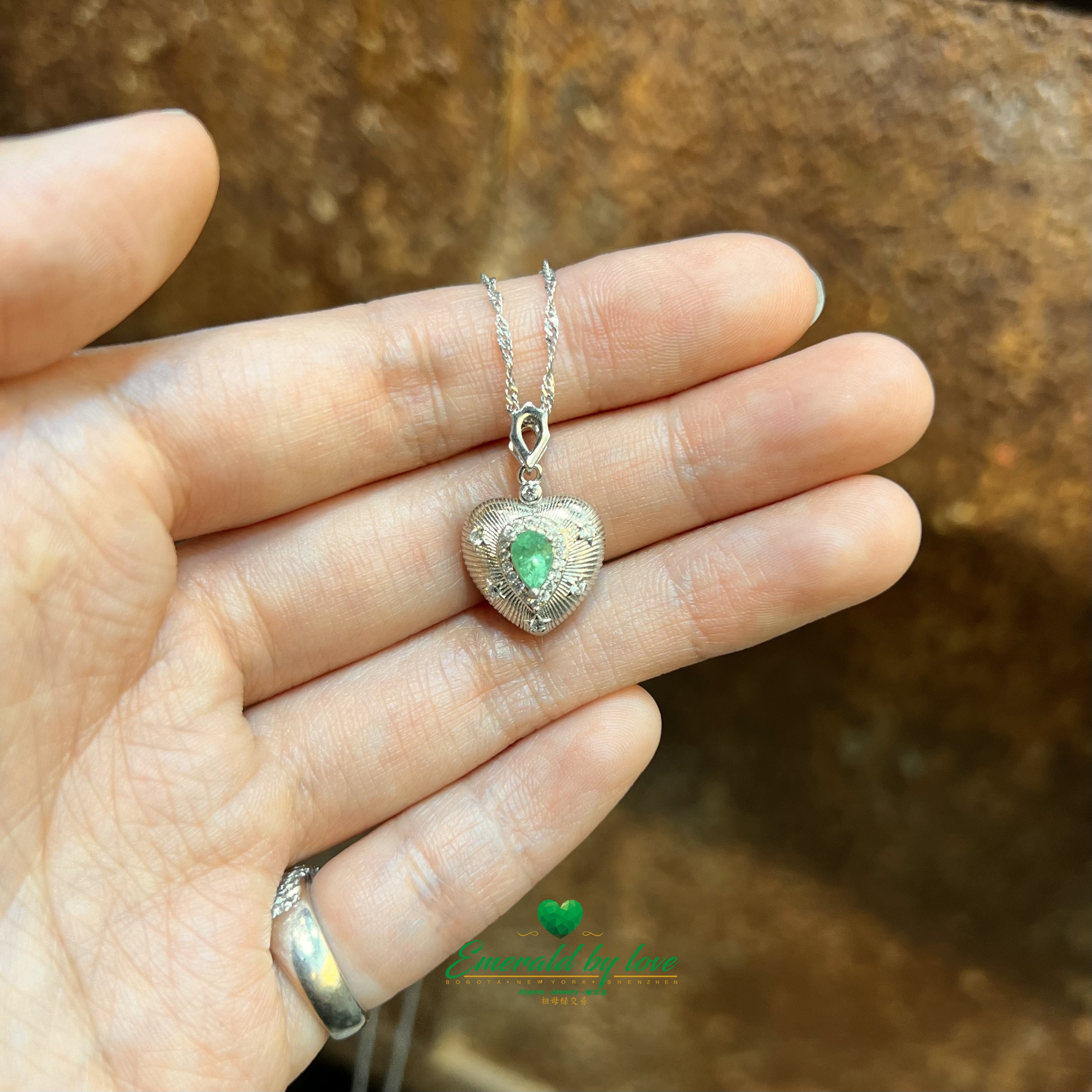 Sterling Silver Heart Pendant with Inverted Teardrop Colombian Emerald, Zircon Halo, and Engraved Line Details