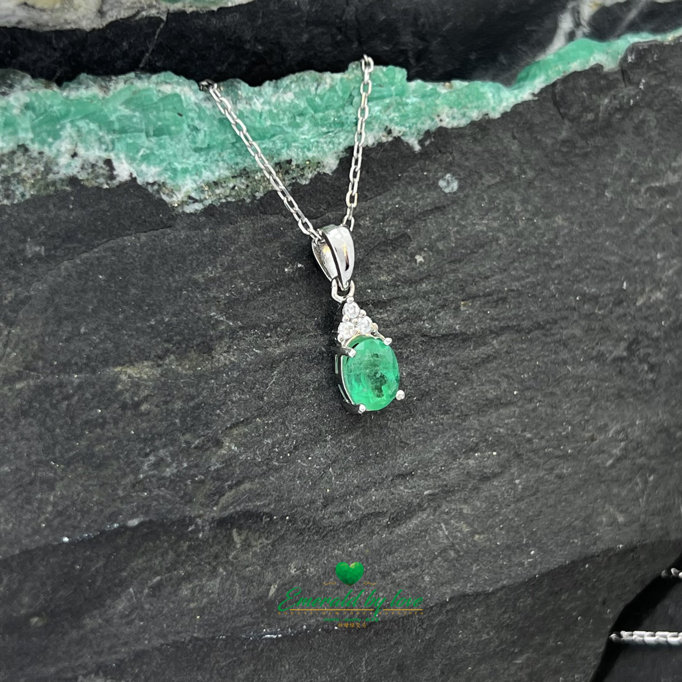 Sterling Silver Oval Crystal Emerald Pendant with Three Zircons