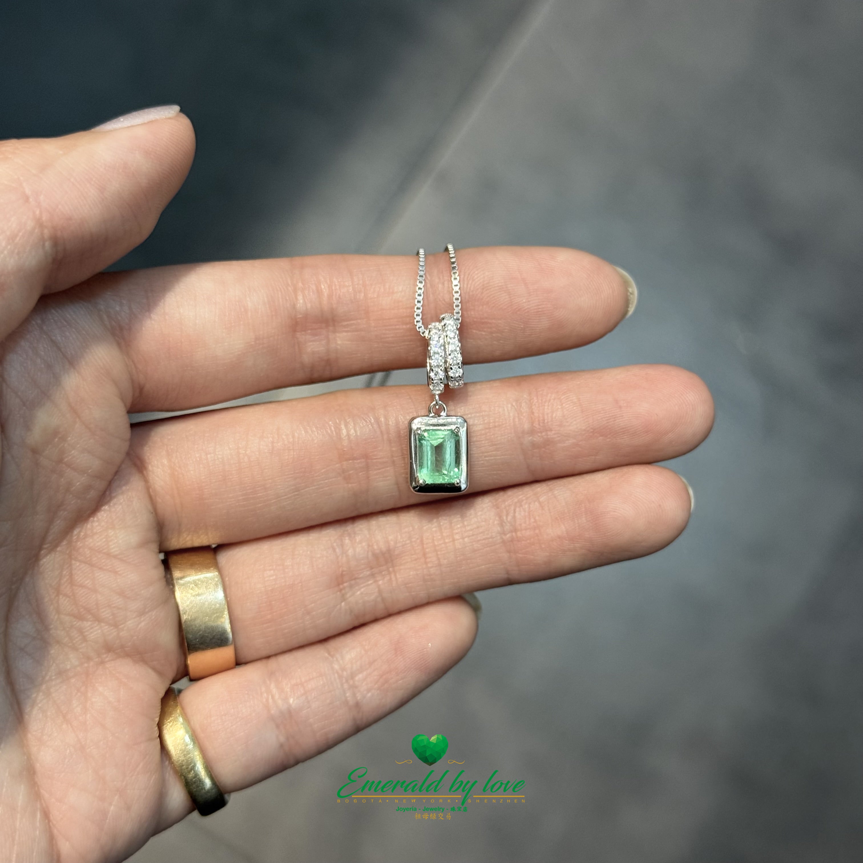 Sterling Silver Chain with Emerald Cut Emerald Pendant and Cubic Zirconia Roll Setting