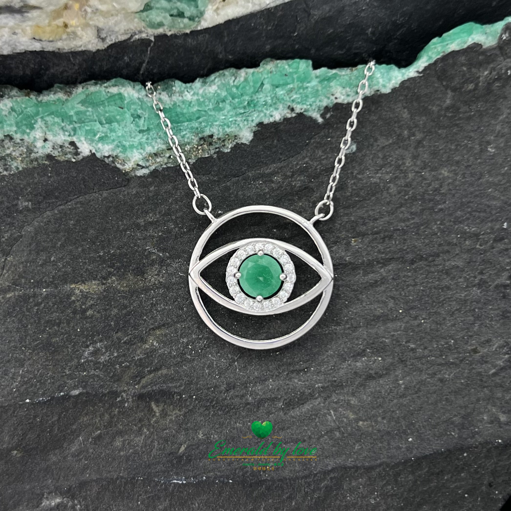 Eye-Shaped Amulet Pendant with Central Round Emerald