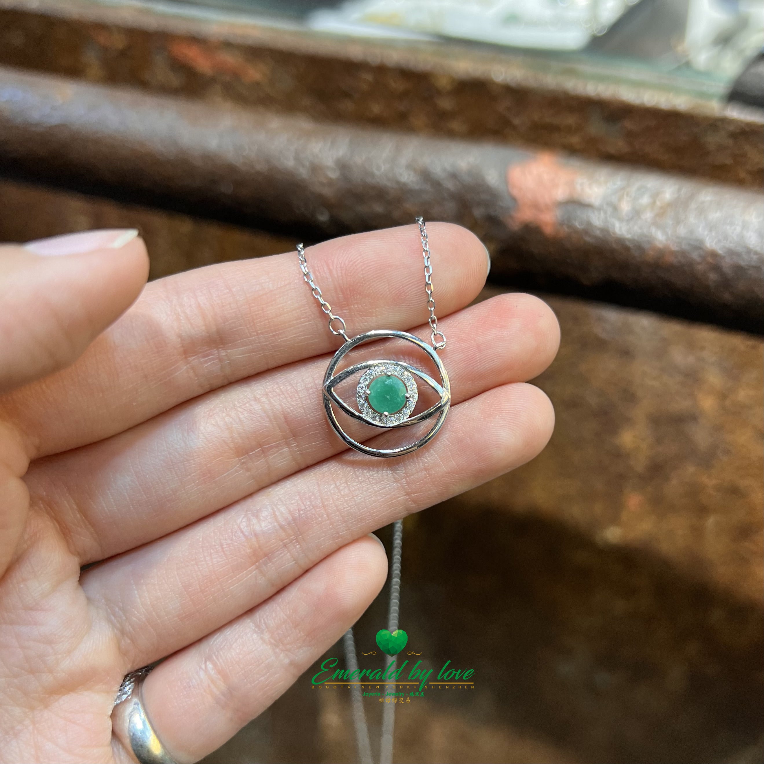 Eye-Shaped Amulet Pendant with Central Round Emerald