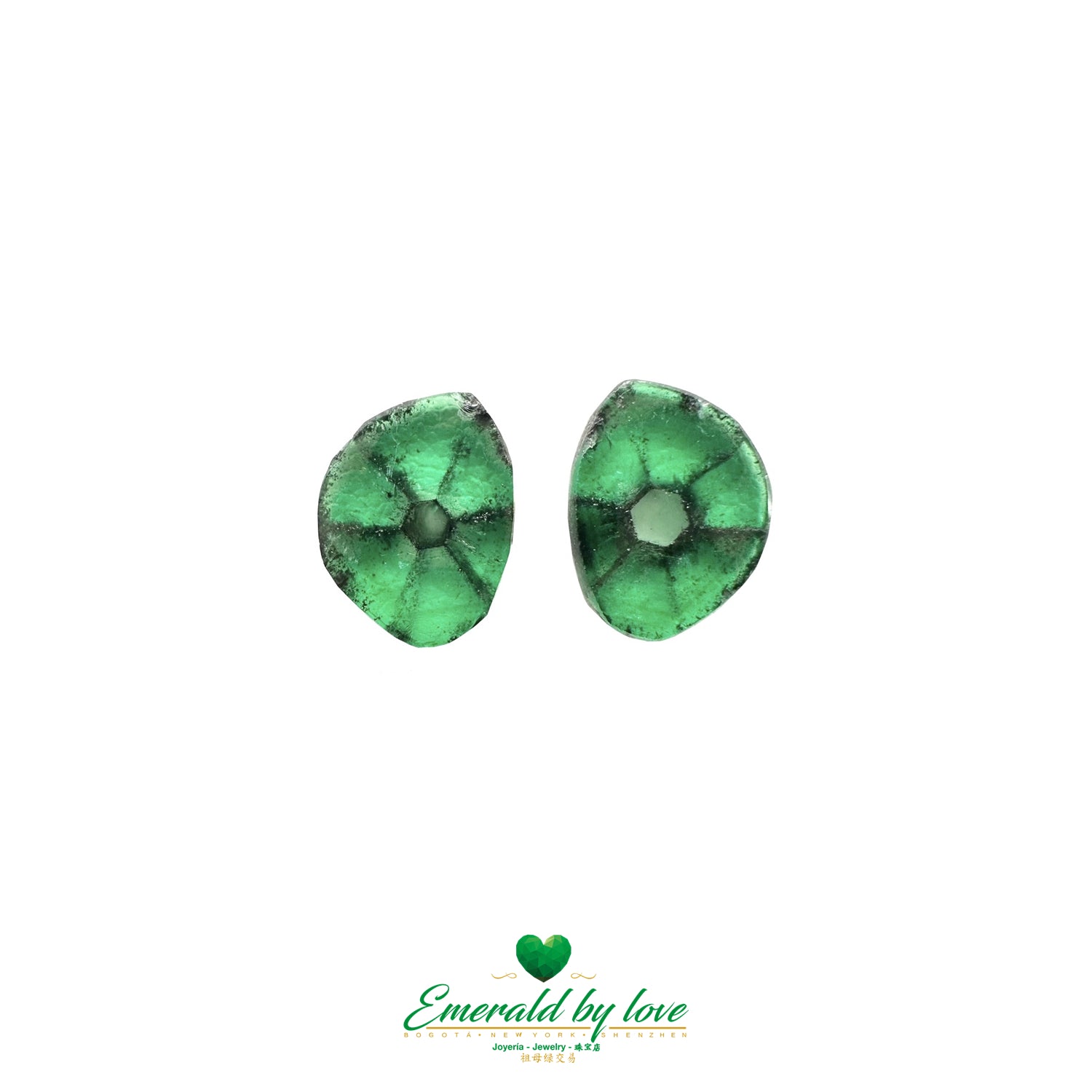 Two authentic Colombian trapiche emeralds featuring unique star-shaped patterns