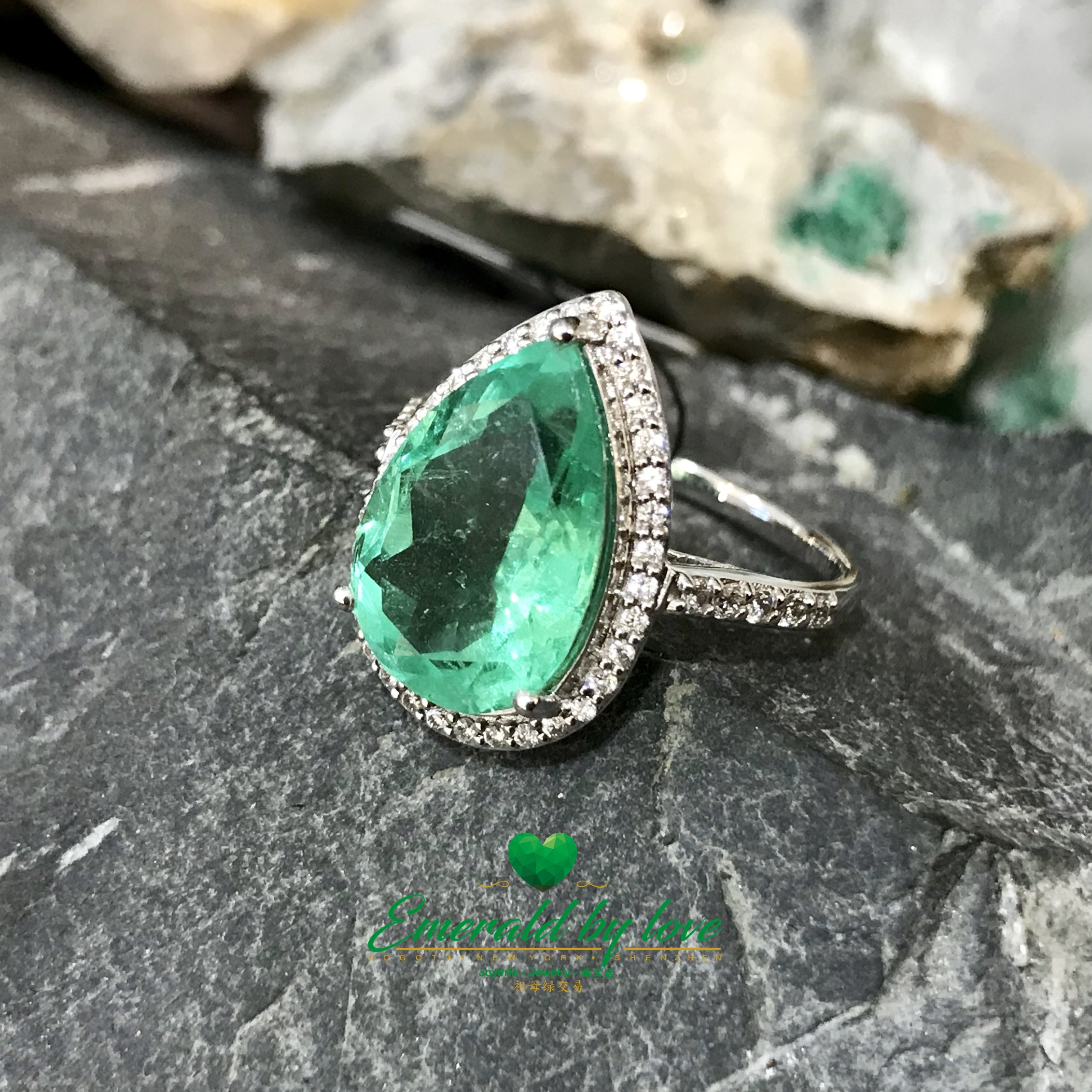 Sparkling Teardrop Halo Colombian Emerald Ring in 18k White Gold