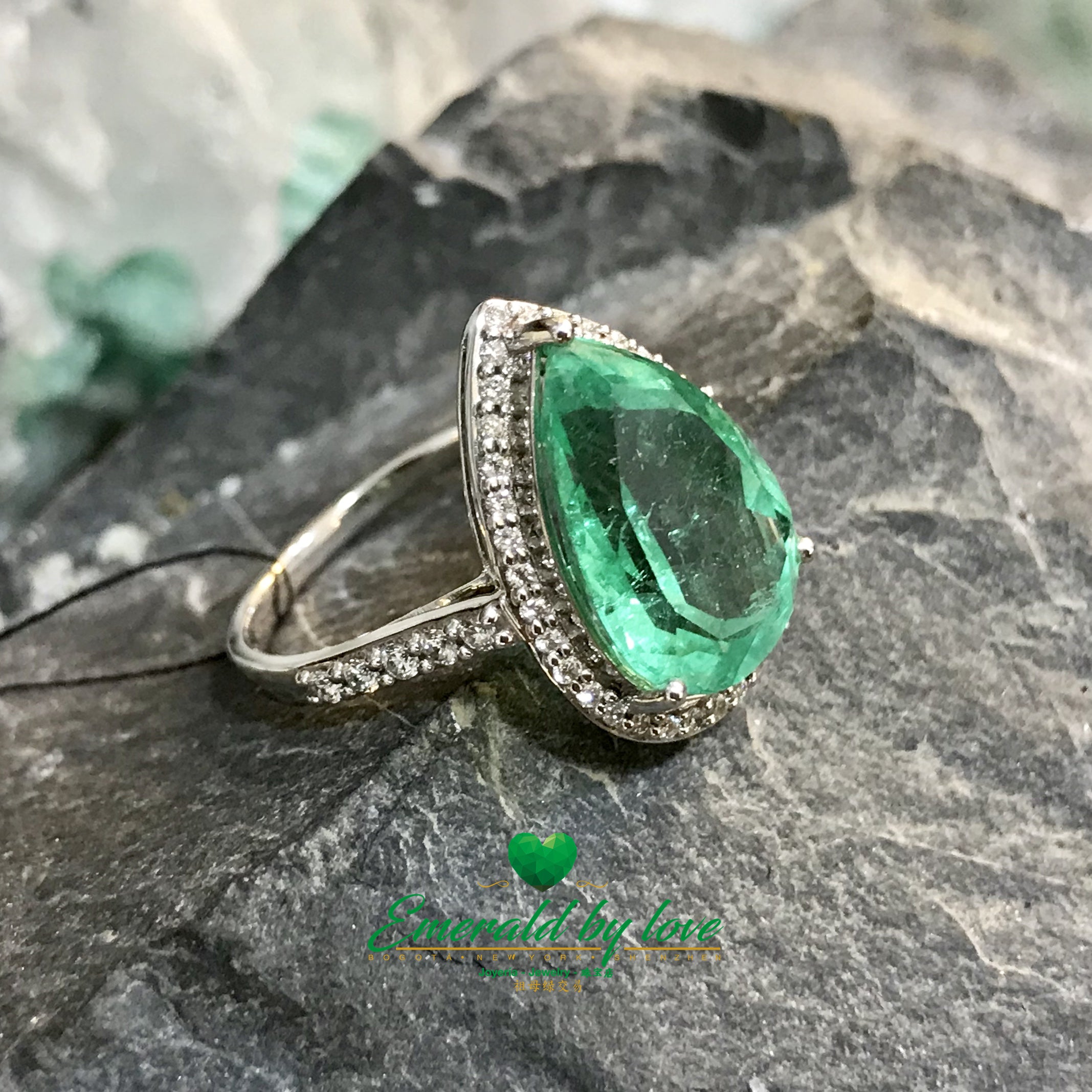 Sparkling Teardrop Halo Colombian Emerald Ring in 18k White Gold