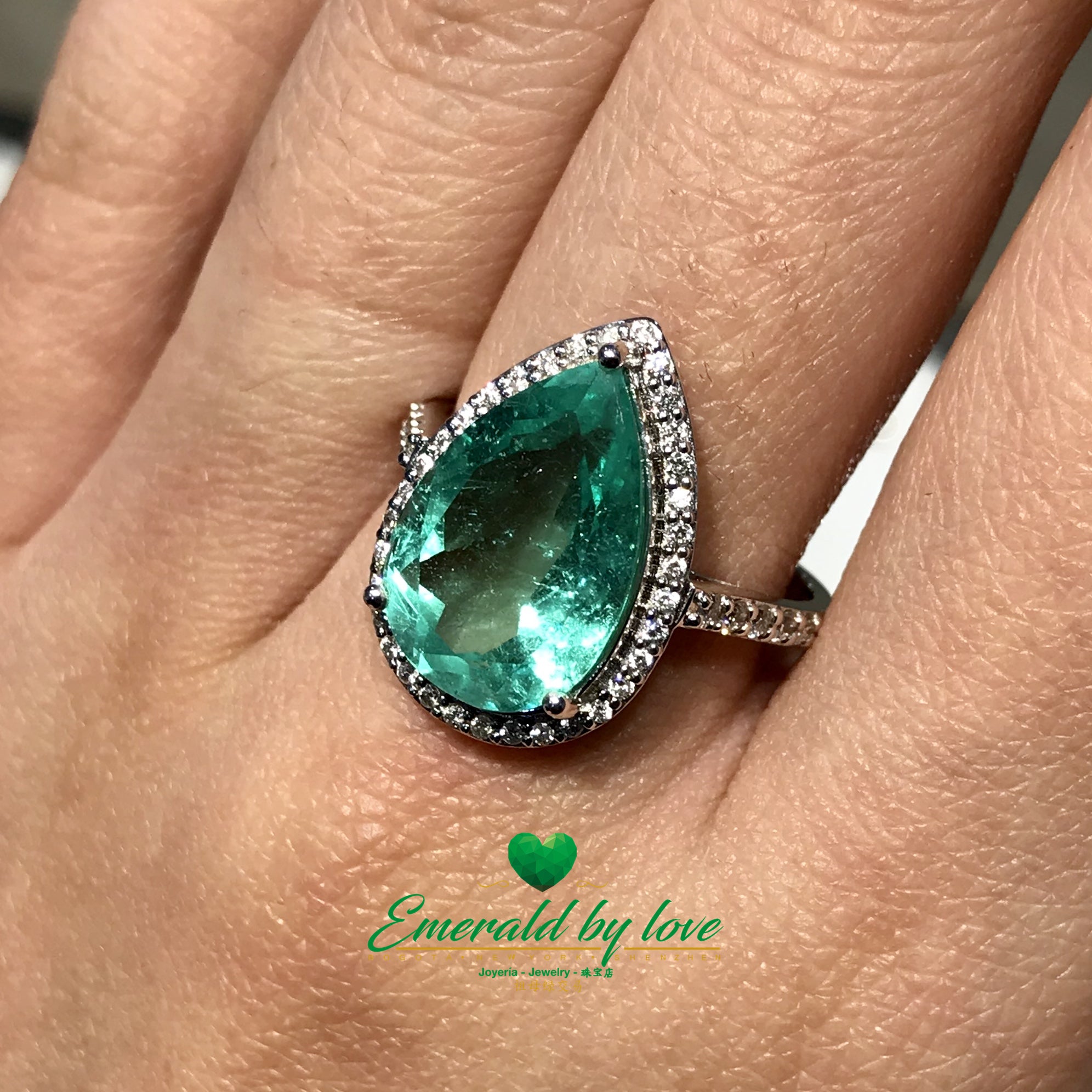 Sparkling Teardrop Halo Colombian Emerald Ring in 18k White Gold