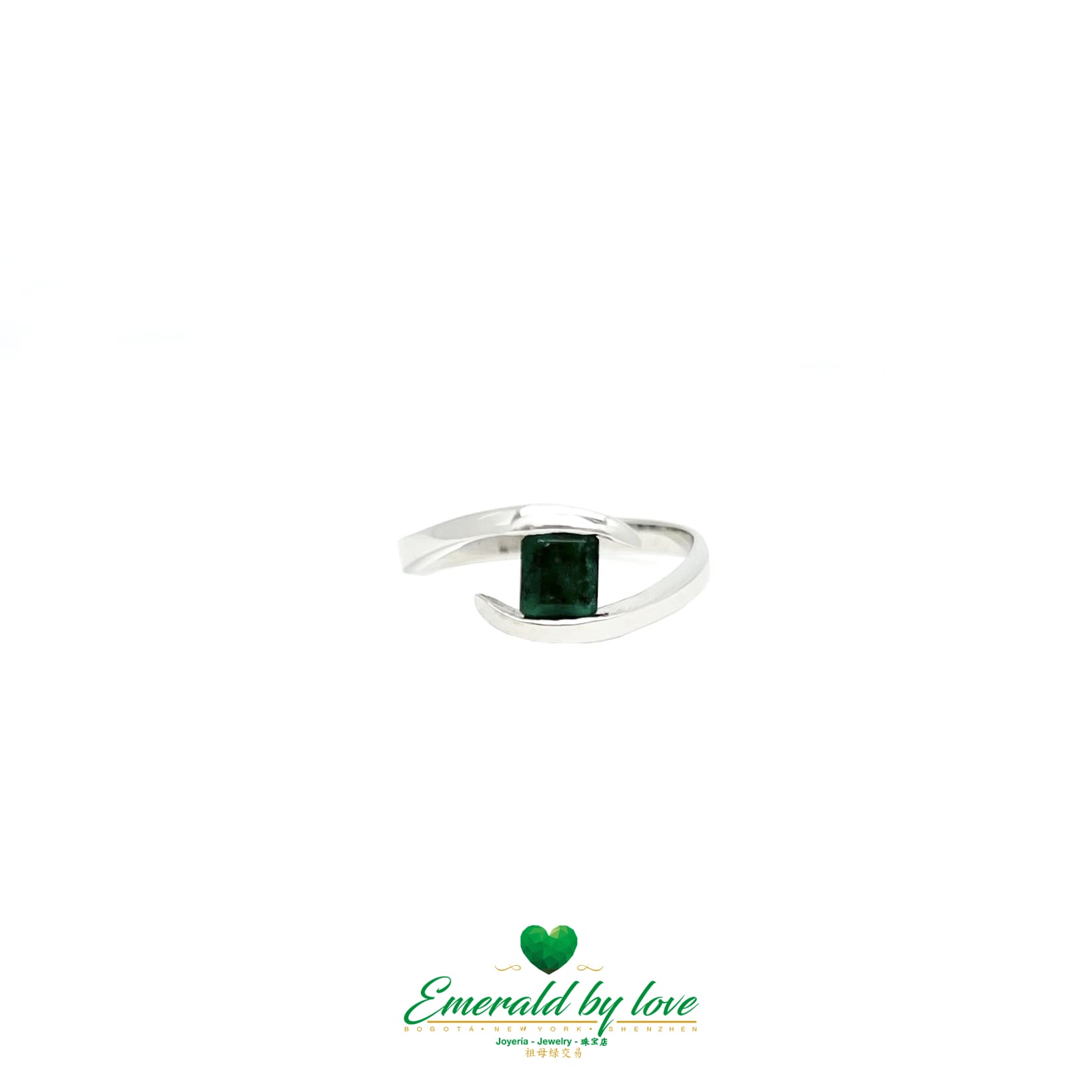 Sleek White Gold Ring with Diagonal Band and Square-Cut Emerald